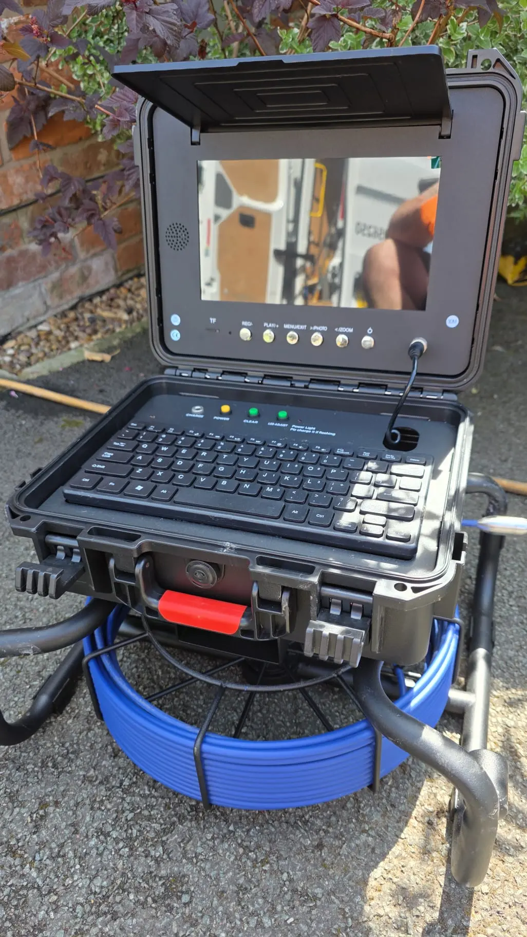 Professional CCTV drain survey equipment set up on site
