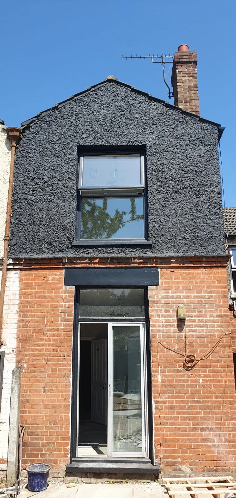Professional exterior painting and decorating on a residential house by FLEX PROPERTY SERVICES.