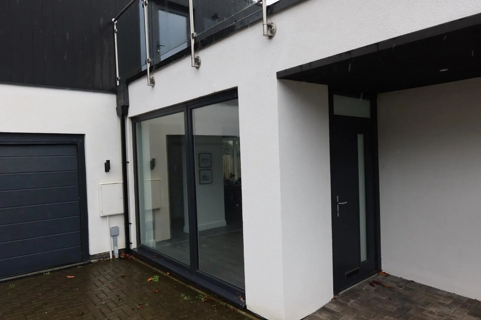 Modern home exterior featuring crisp white silicone rendering