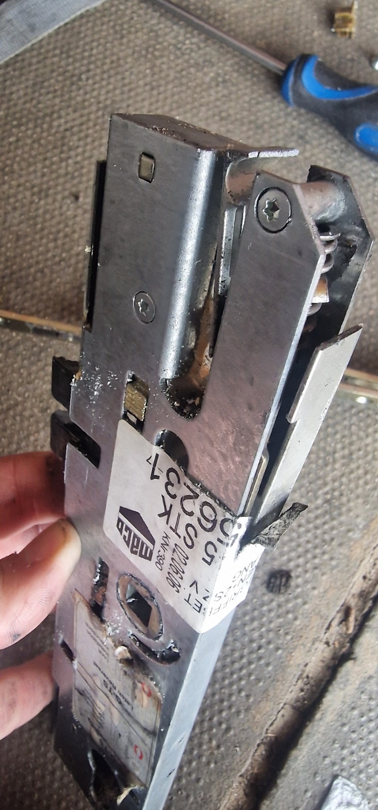 A damaged MACO multi-point lock gearbox for a uPVC door, requiring repair or replacement by Fortify Locksmiths.