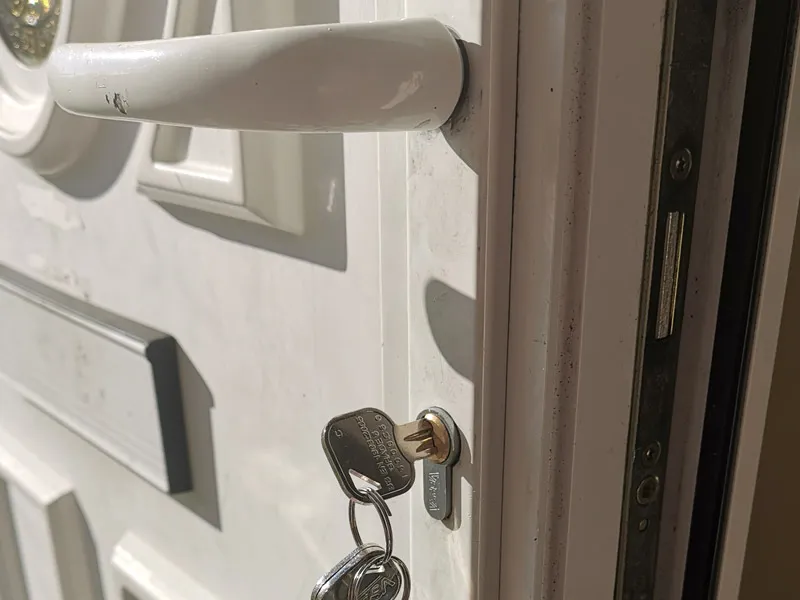 A key in a uPVC door lock with the multi-point locking mechanism visible