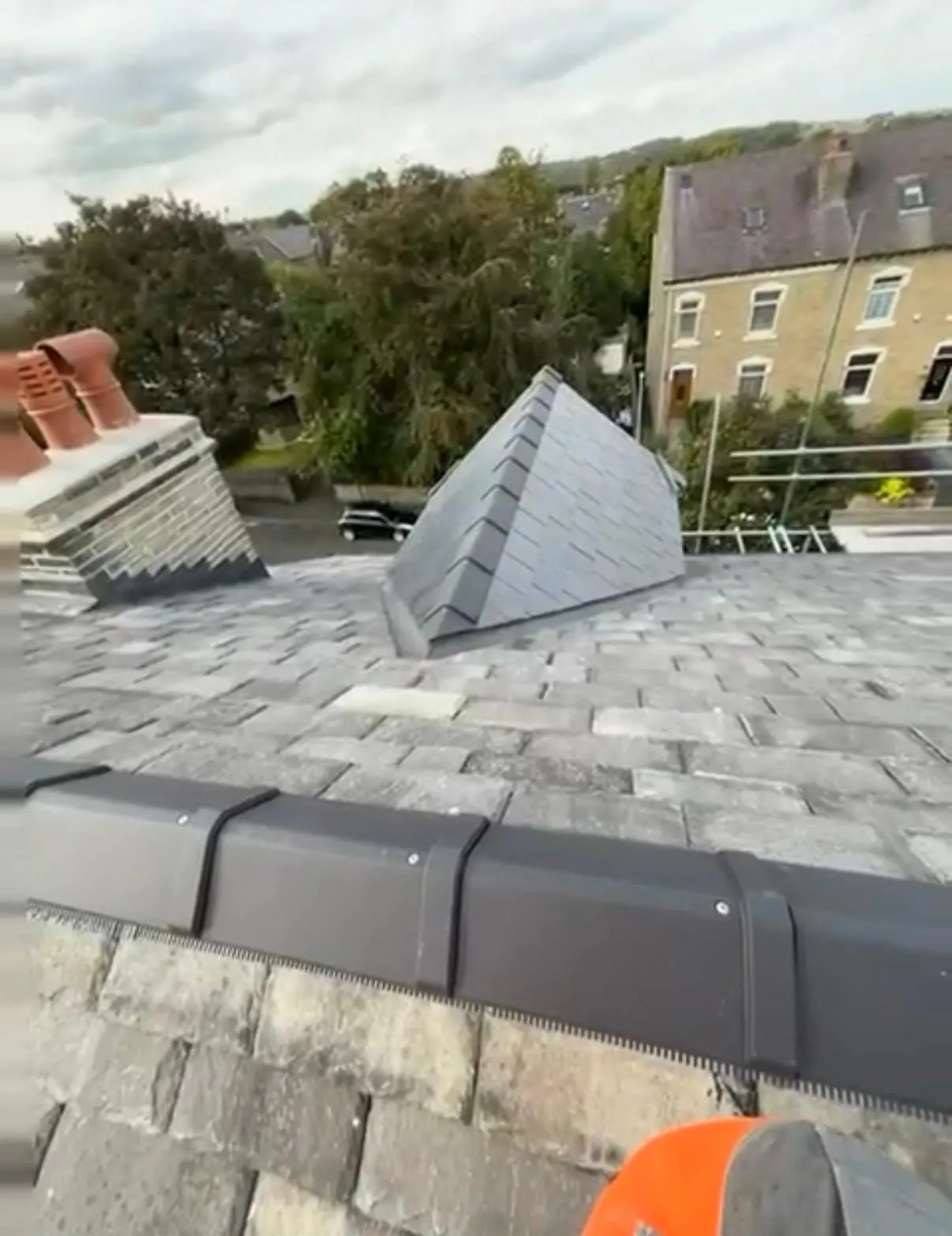High-quality stone roofing and dry-fix ridge system installation by Tyler's Roofing Services in Holmfirth.