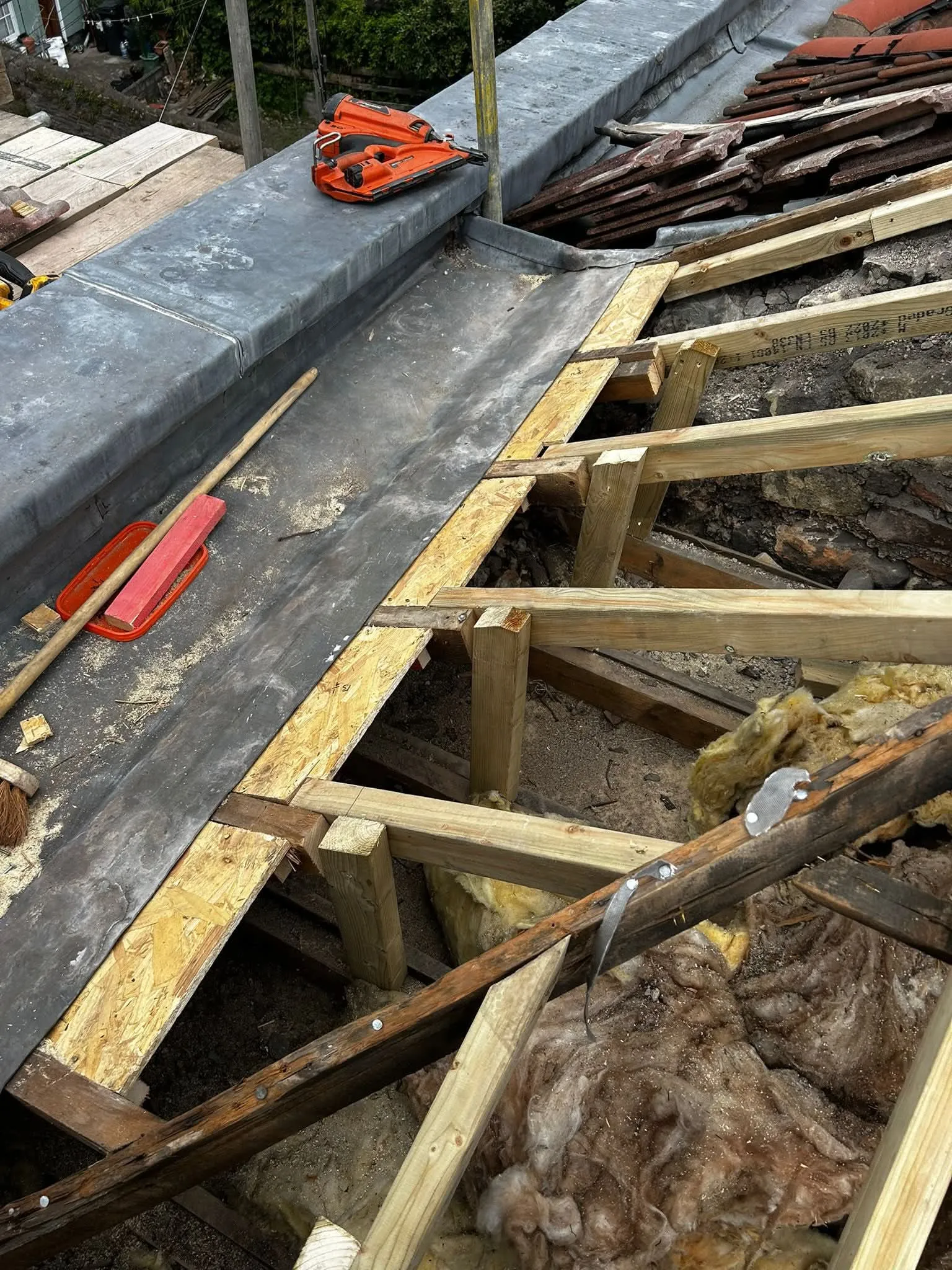 Professional leadwork and roof timber repairs in progress by NTL Roofing