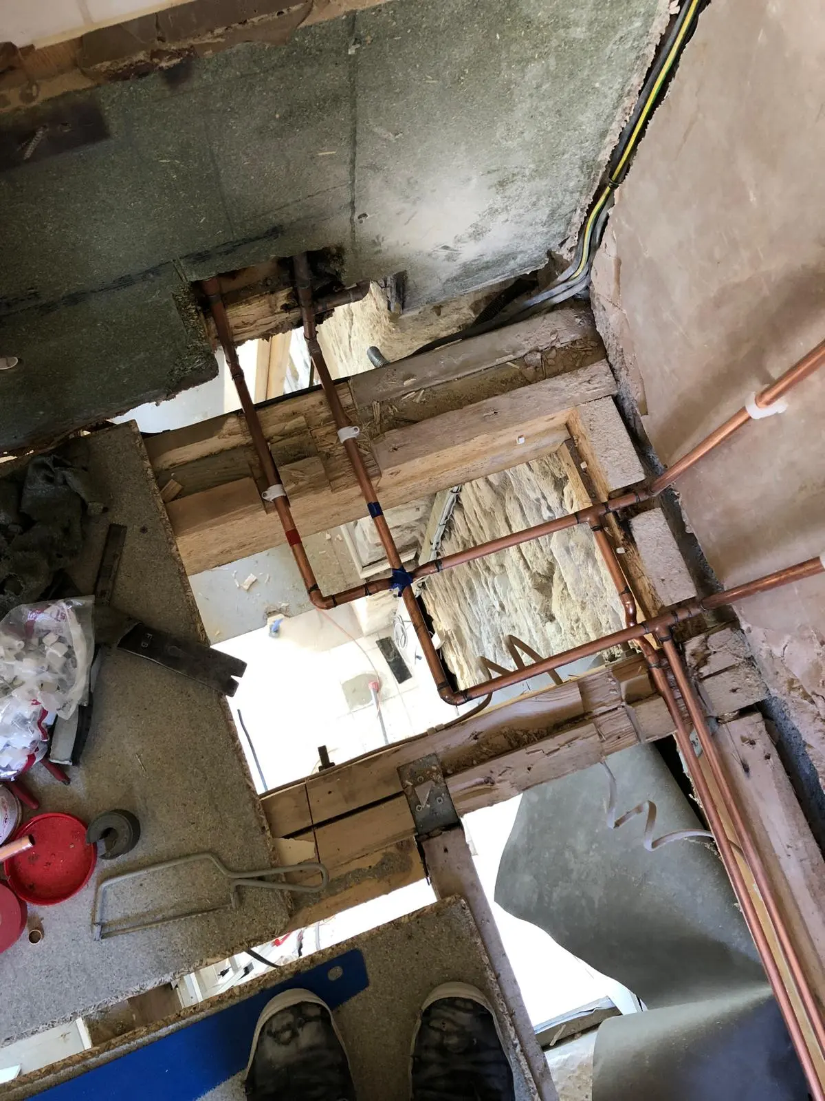 Expert plumbing pipe rerouting and installation under floorboards by BC Plumbing in Frome.