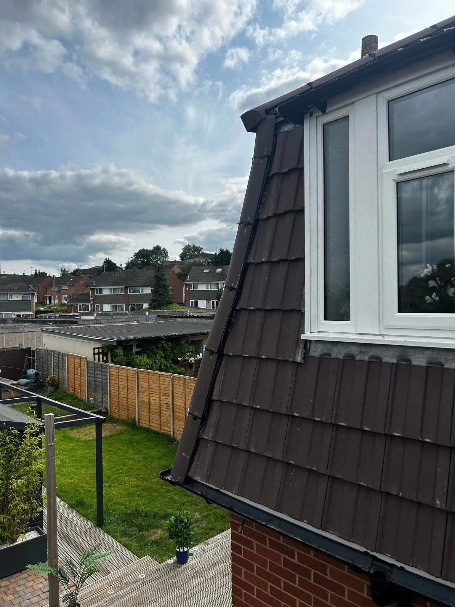 Close-up of a tiled roof and dormer window on a residential property in Swindon