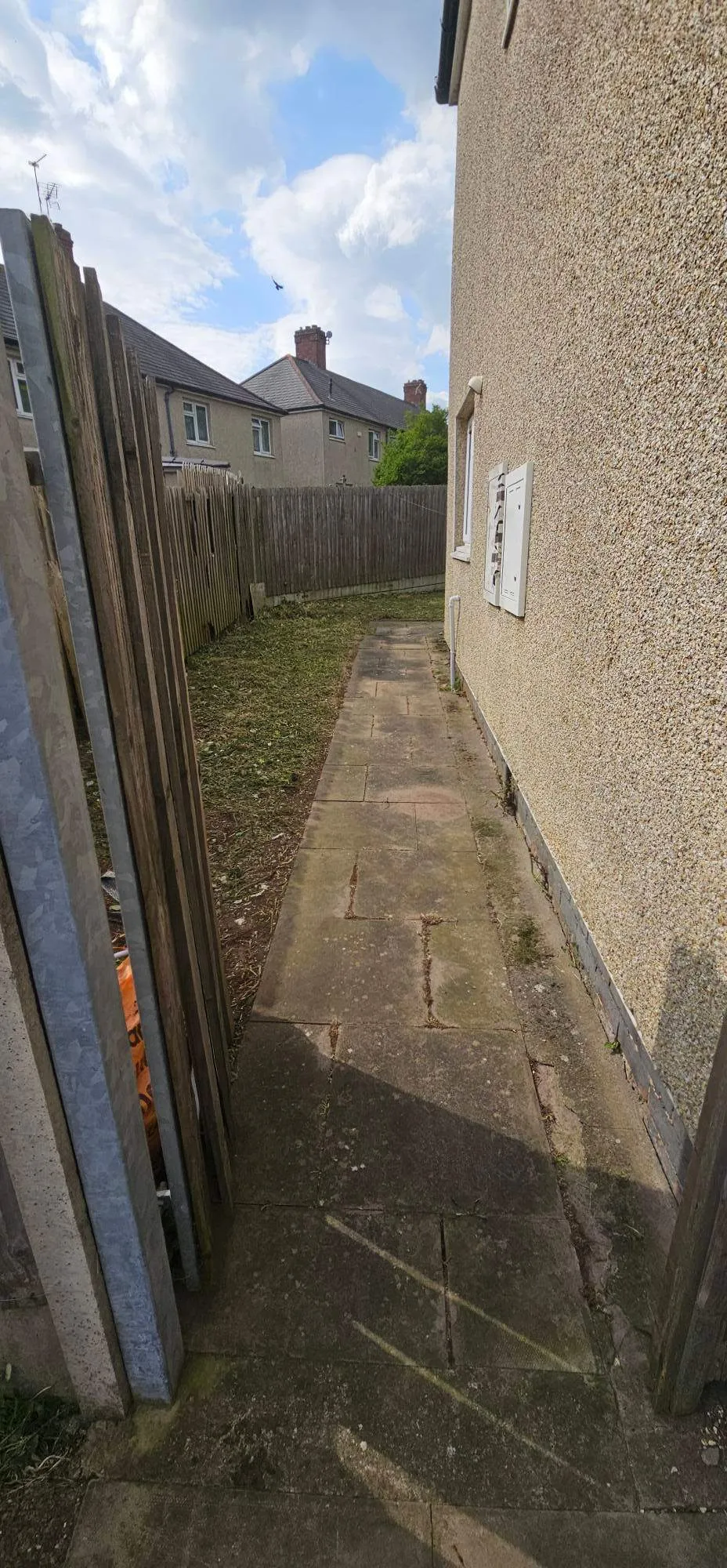 Cleared paved side pathway and tidy residential garden access in Birmingham