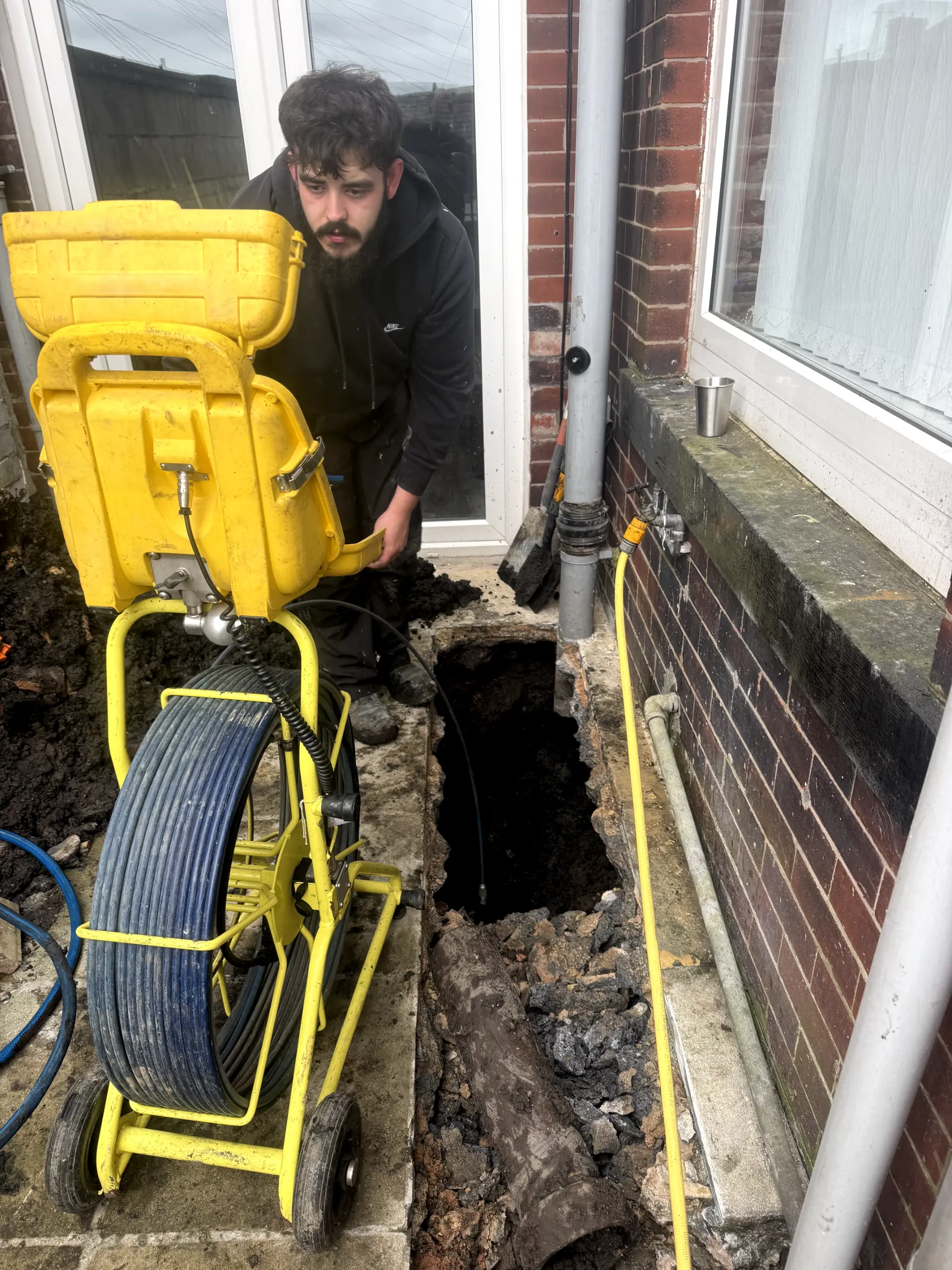 WGS Services engineer performing drain excavation and inspection in Darwen.
