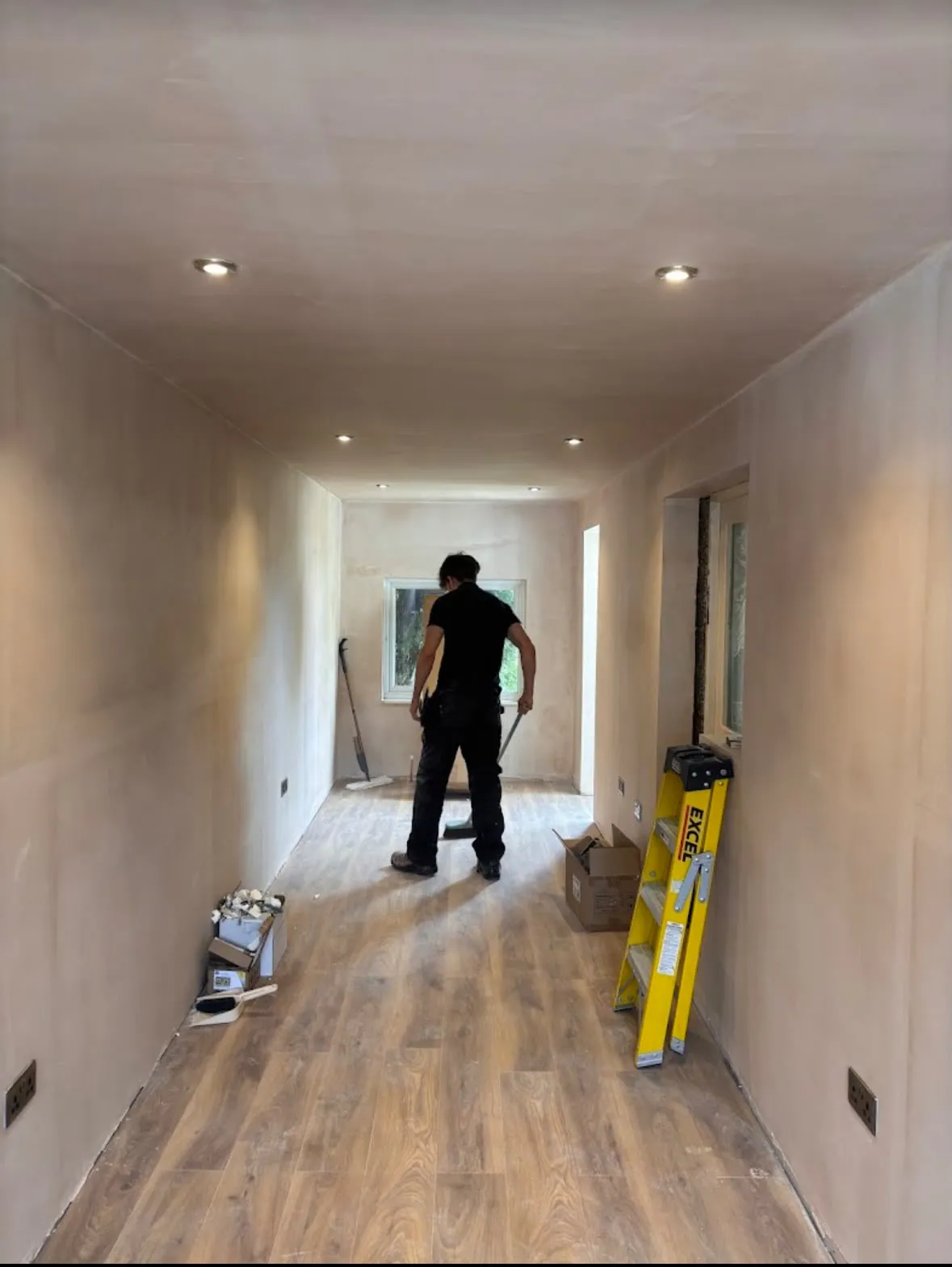Recessed ceiling downlights and metal socket installation in a newly plastered Sussex home extension by Sussex Brown Sparks