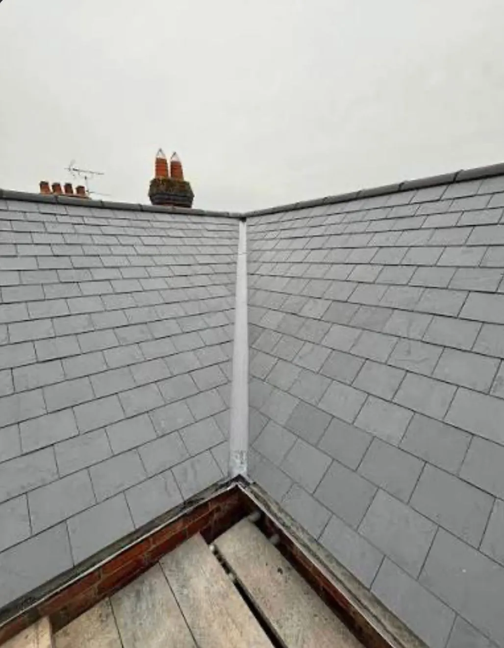Expert slate roofing and lead valley installation by Sky Top Roofing LTD.