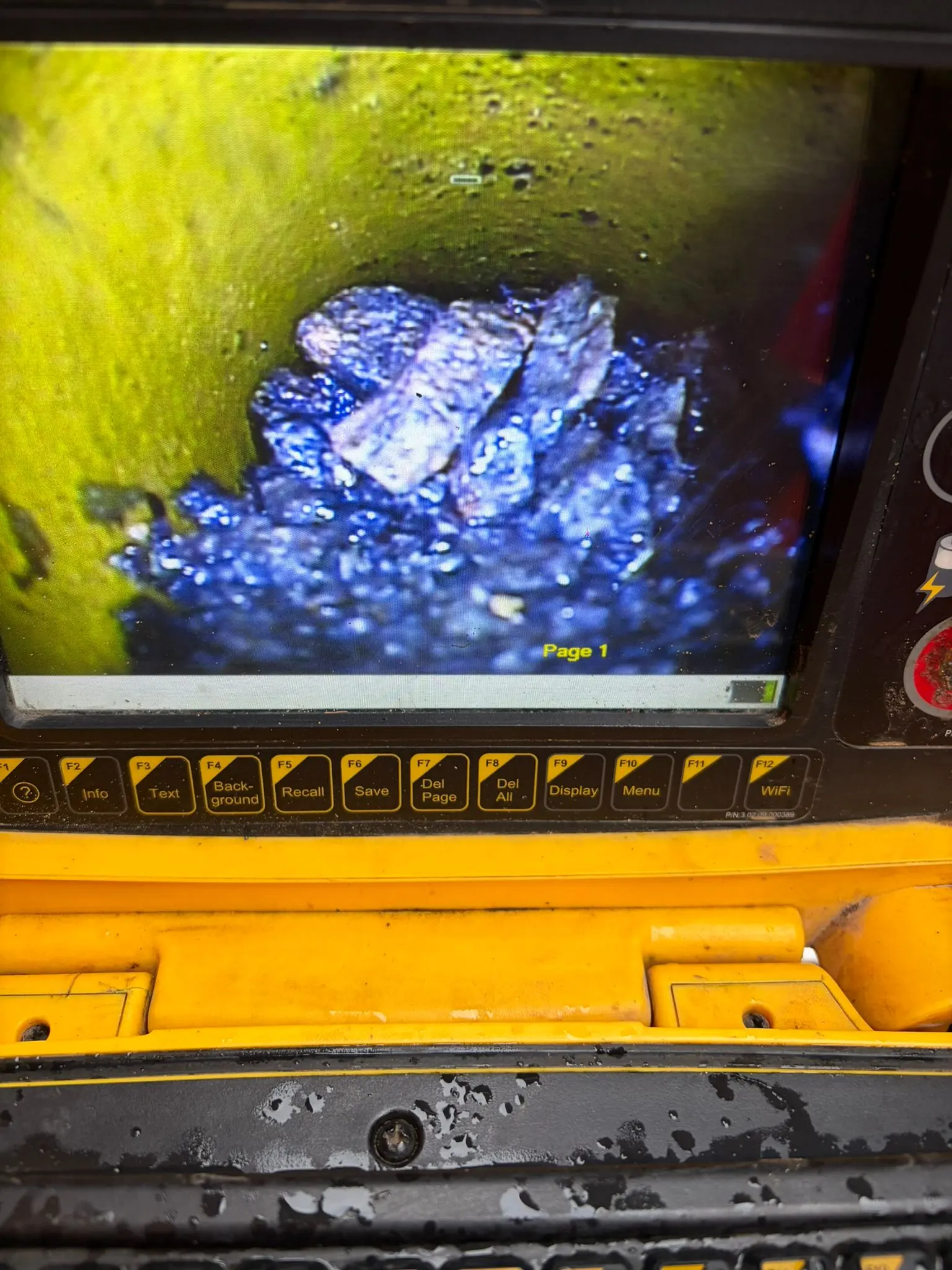 CCTV drain survey monitor displaying blockage