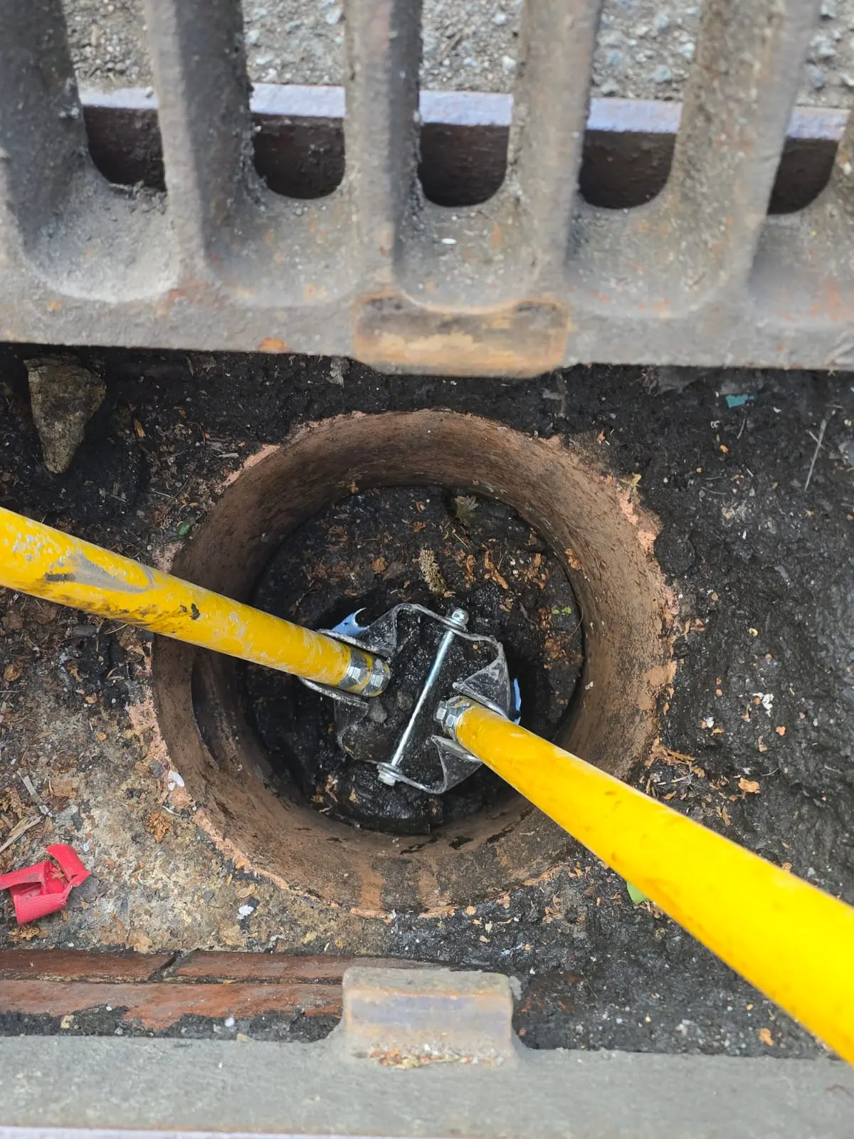 Drain unblocking tool inserted into a drain to clear a blockage