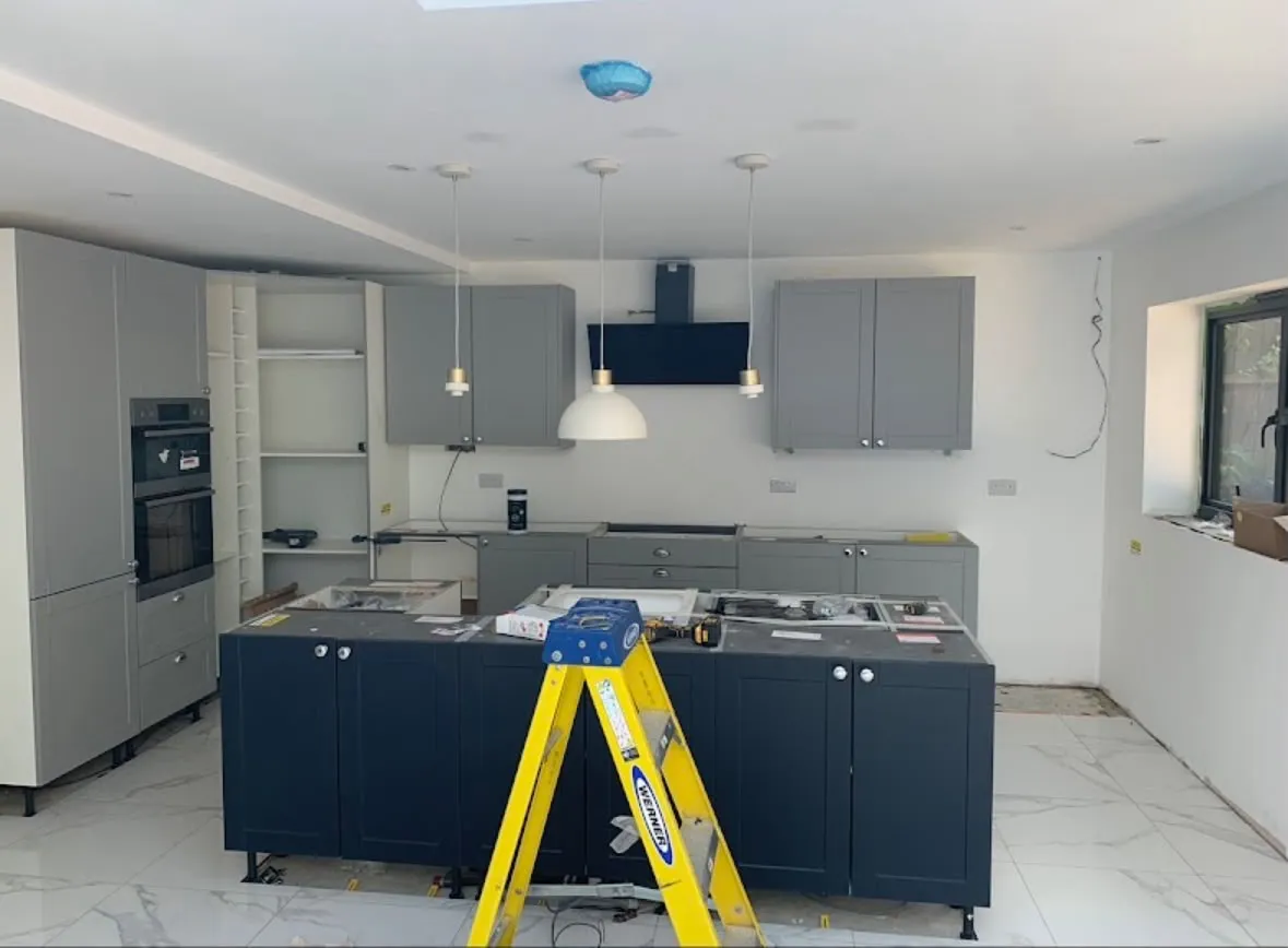 Kitchen electrical installation and partial rewiring showing island pendant lighting and appliance feeds
