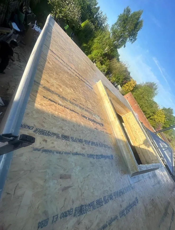 OSB3 timber deck and raised skylight kerb prepared for flat roof waterproofing