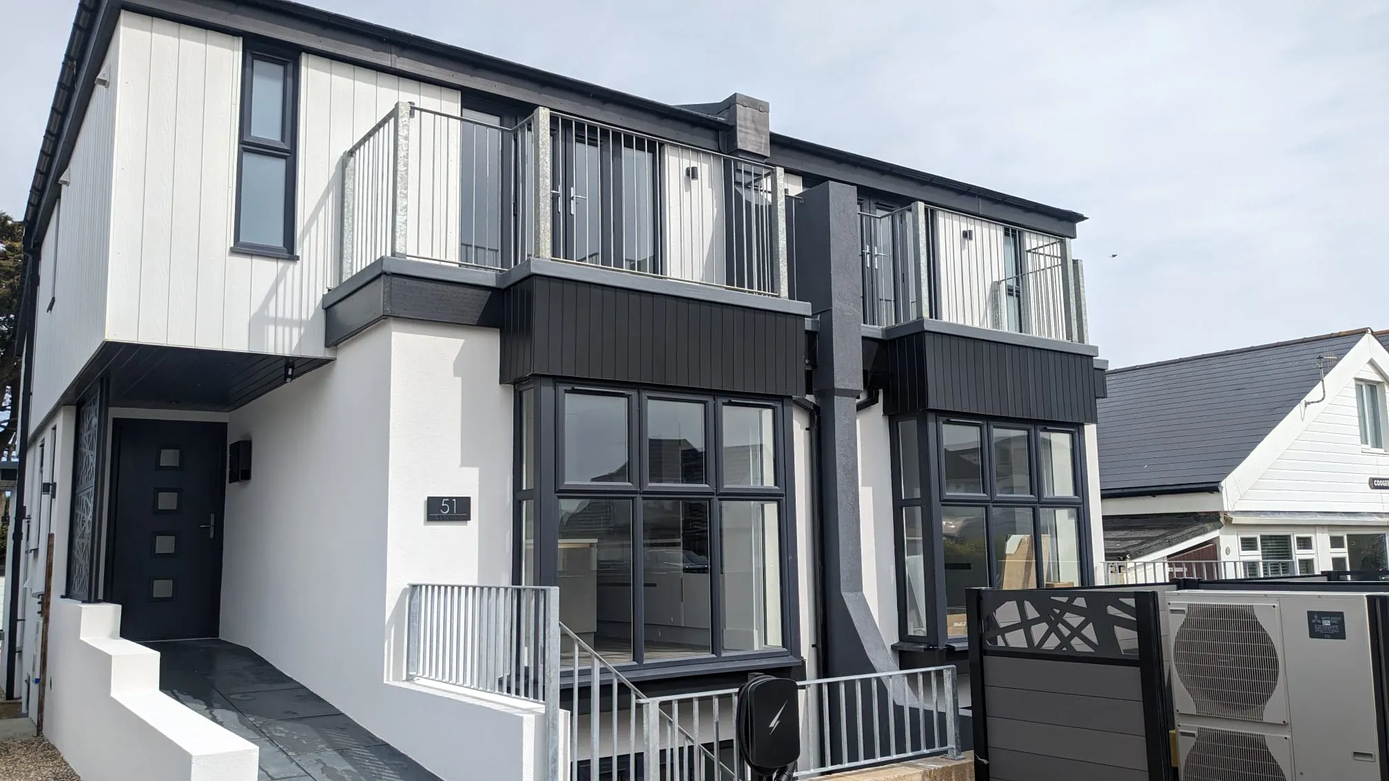High-quality white external rendering on a modern house in the Portslade and Brighton area.