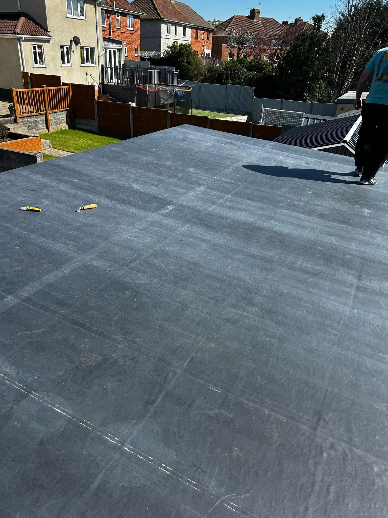Professional flat roofing installation on a domestic property