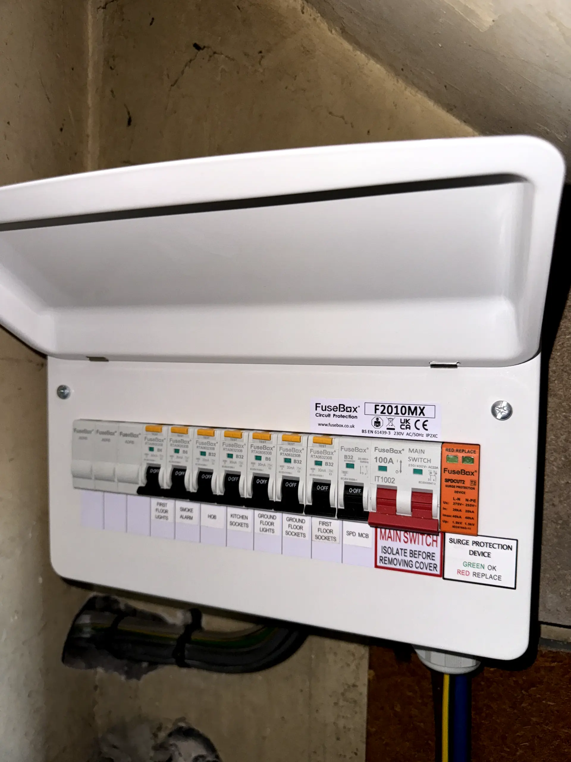 A newly installed metal-clad FuseBox consumer unit with surge protection and clearly labelled circuits