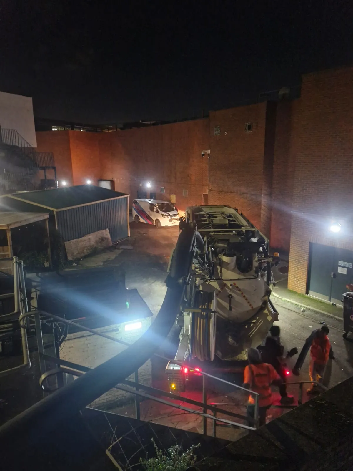 Roberts Drainage Ltd vacuum tanker providing emergency liquid waste management at night.