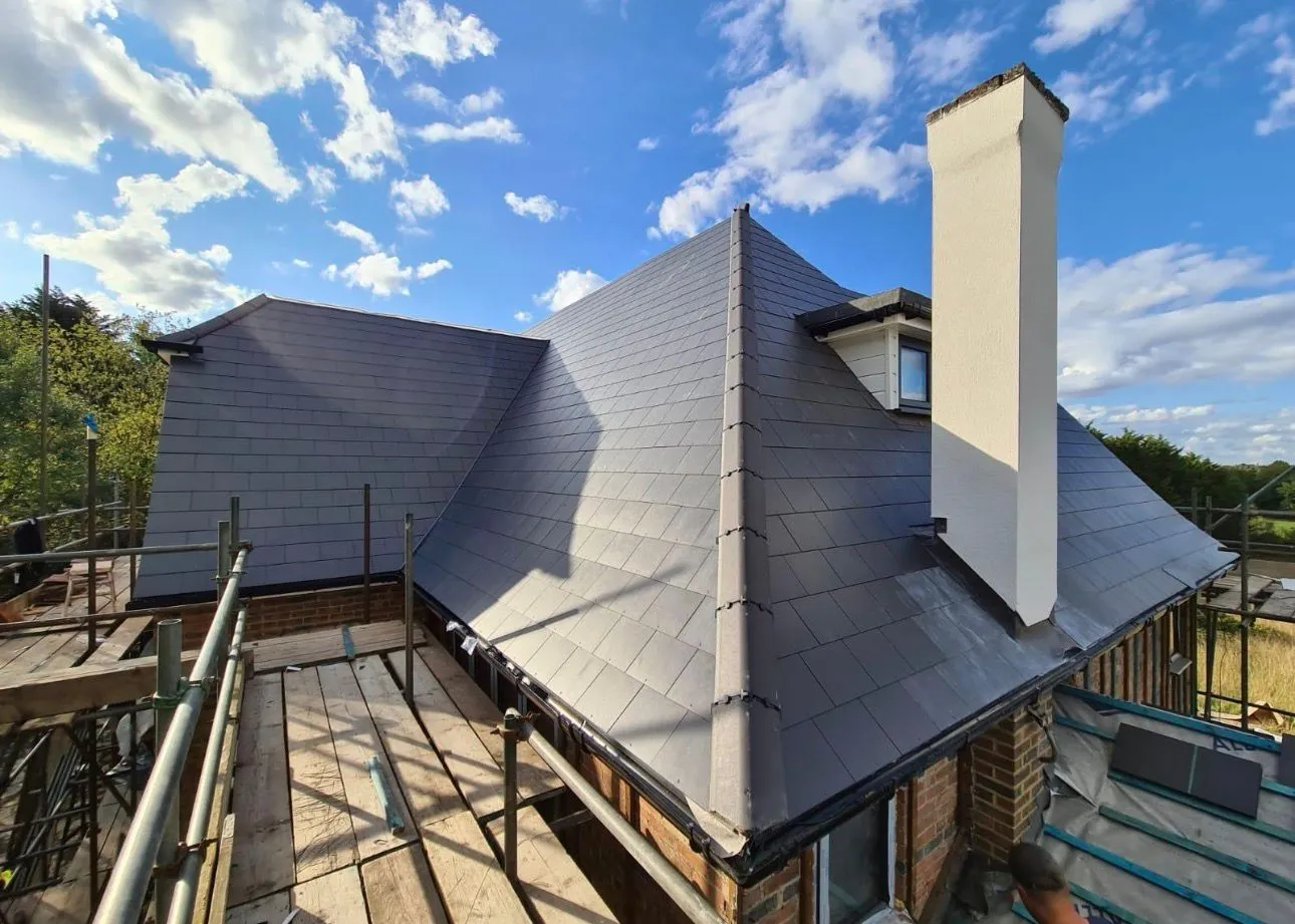 New slate roof installation in Kent by Century Roofing and Building featuring expert chimney lead work