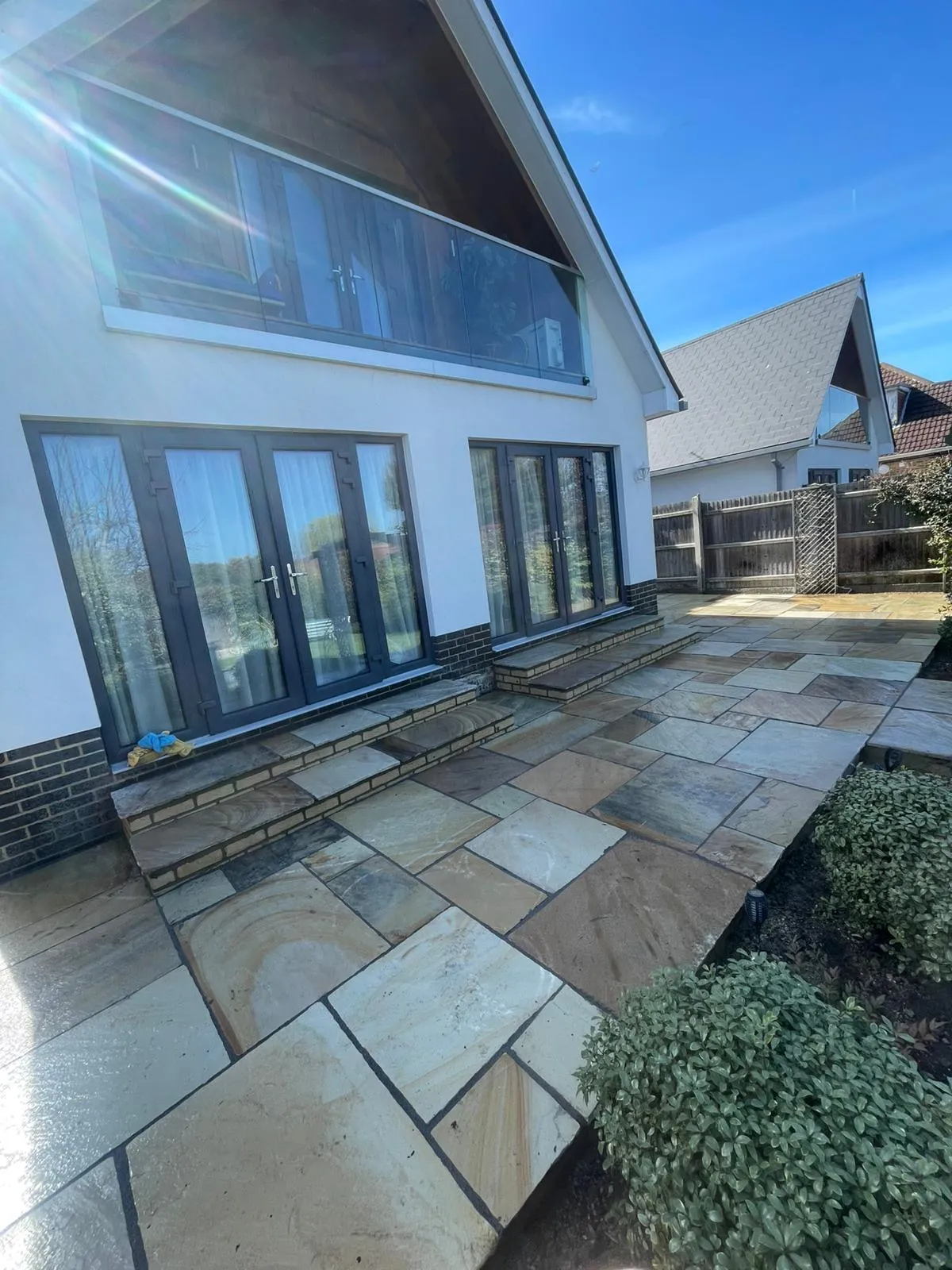 Premium Indian sandstone patio with steps installed by Kent Paving & Resin LTD