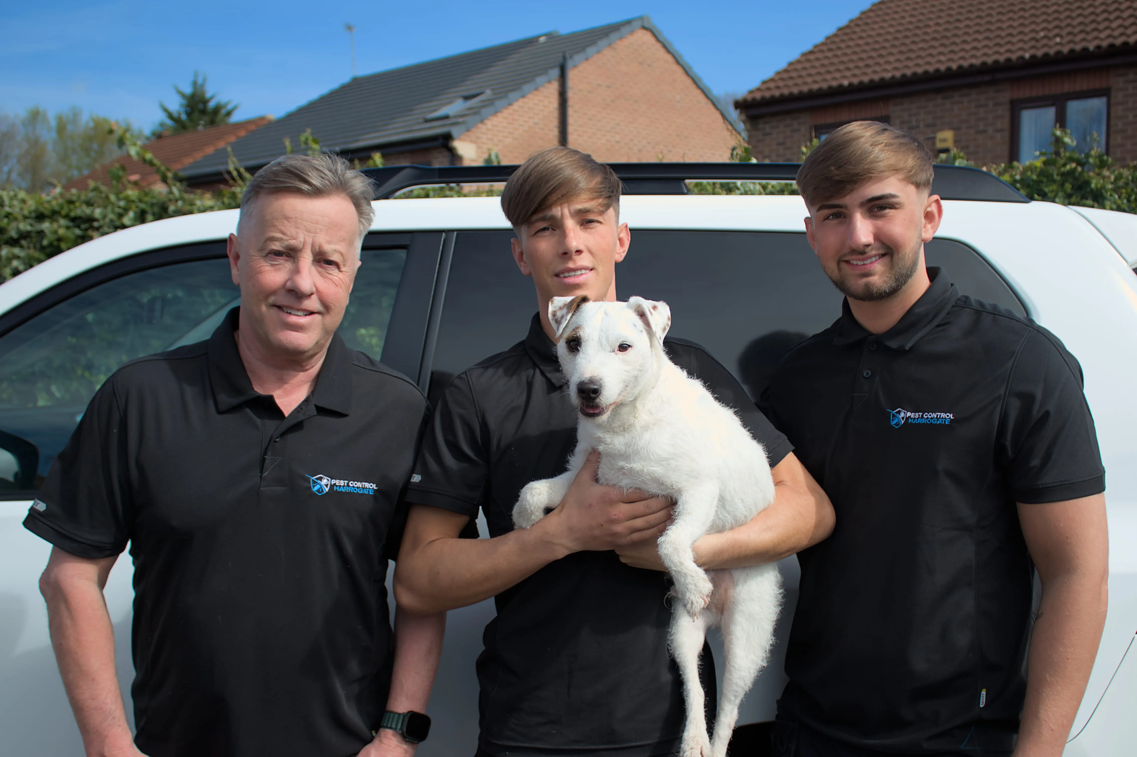 Team of BASIS PROMPT registered technicians from Pest Control Harrogate standing in front of a white van with a small white dog.