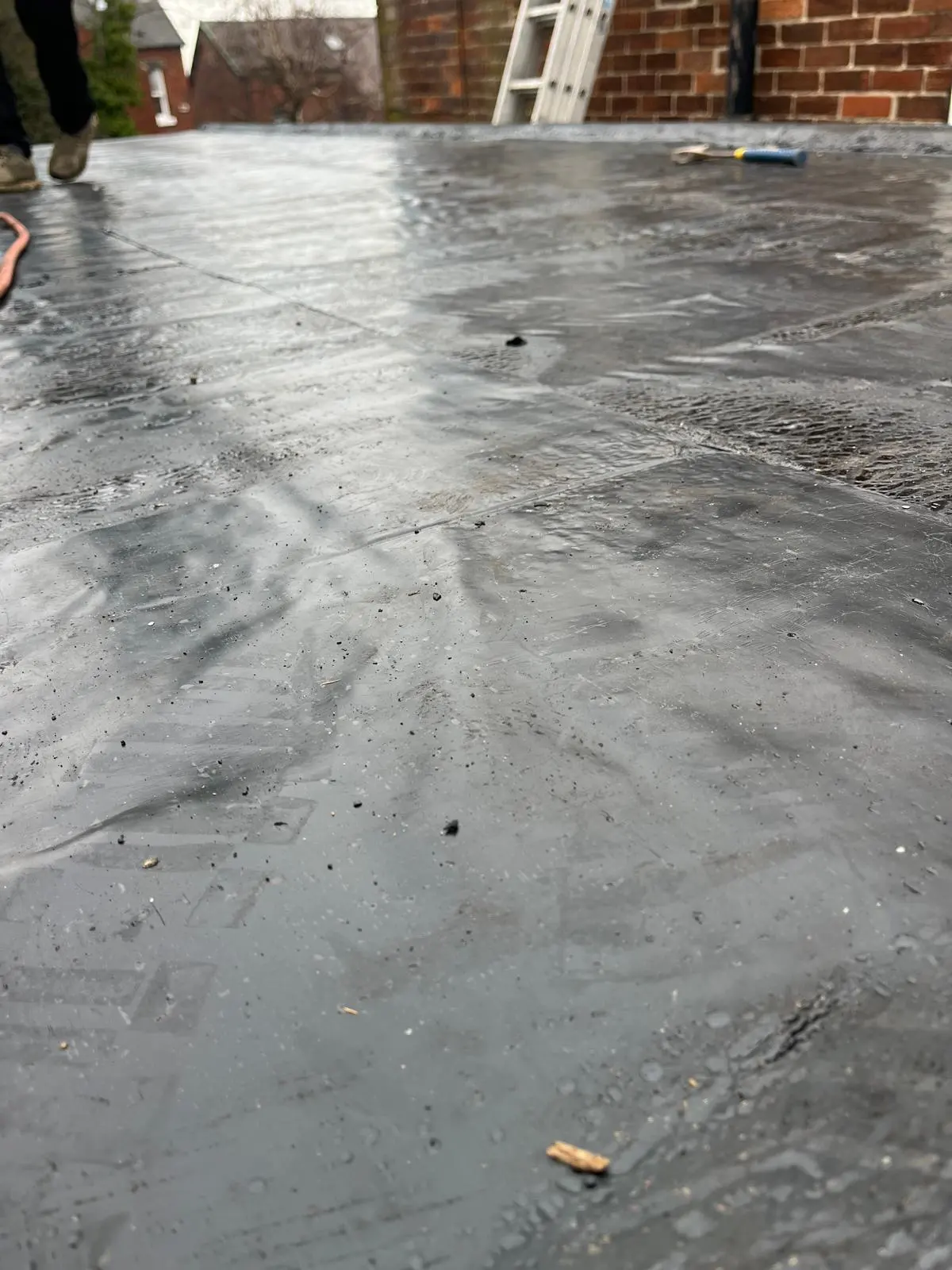 Professional installation of an EPDM rubber flat roof membrane