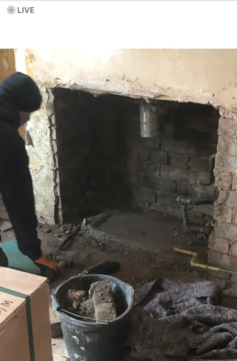Gas Safe engineer preparing a fireplace for gas fire installation in Wolverhampton.