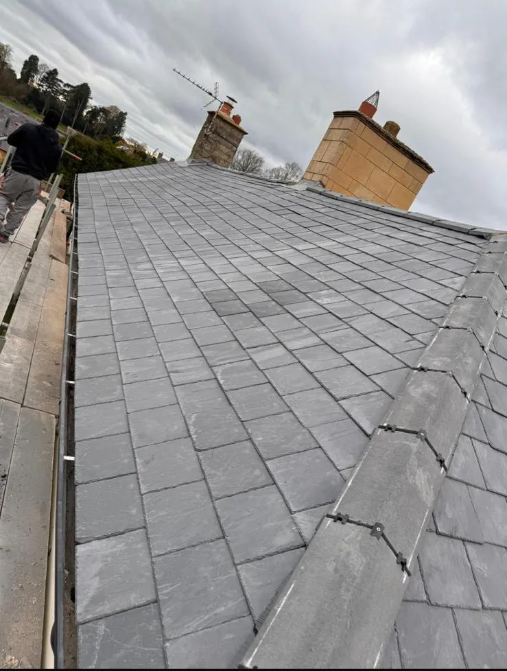 Completed slate roof replacement with dry hip system and chimney leadwork in Plymouth