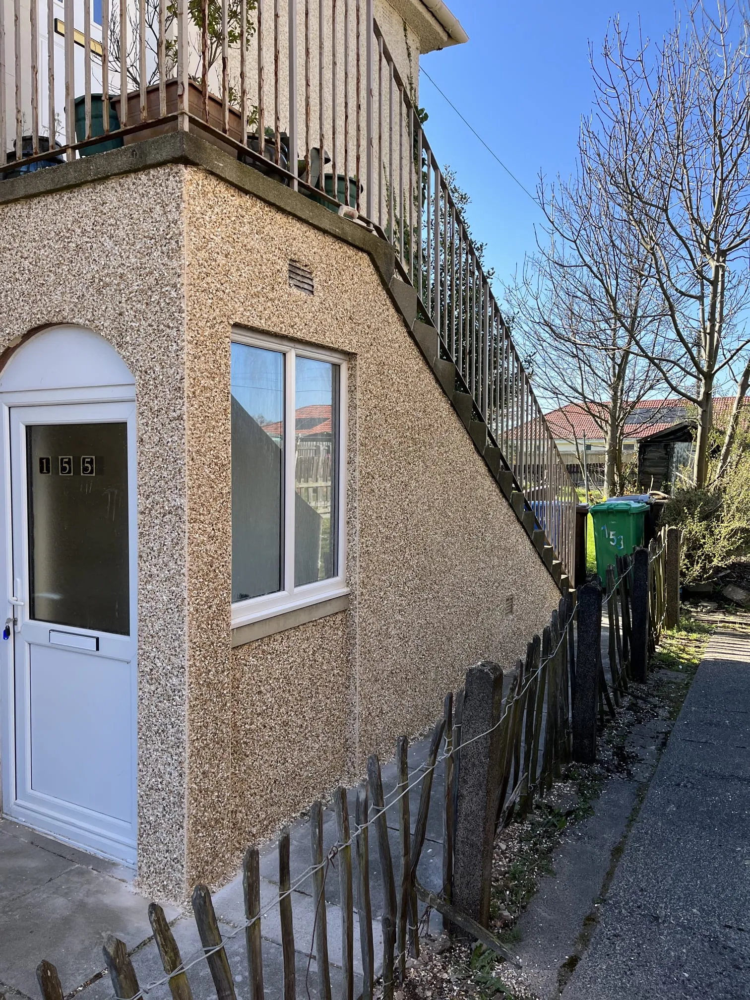 Freshly applied roughcasting and rendering on the exterior walls of a residential home in Fife
