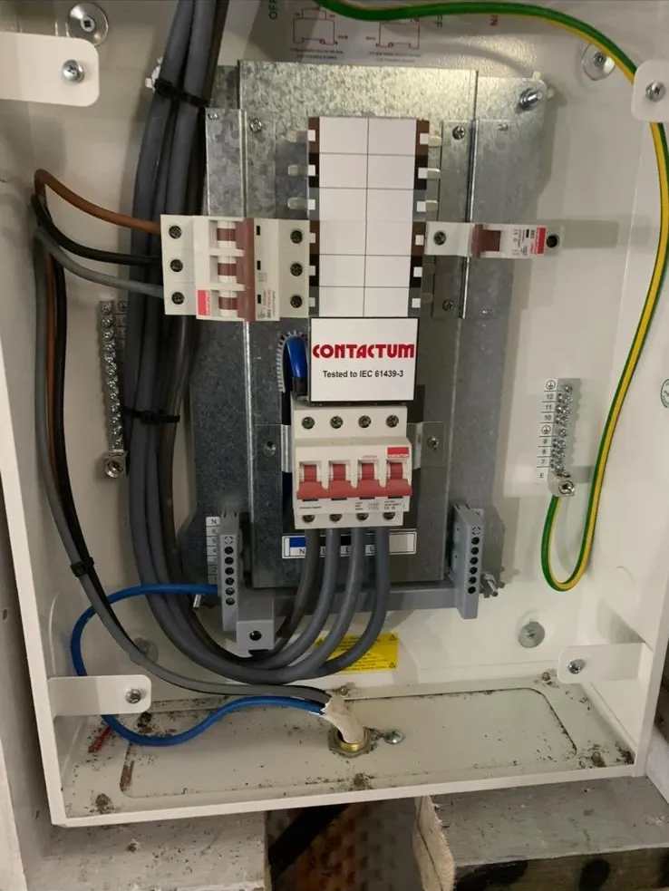 Internal view of a newly wired Contactum three-phase electrical distribution board