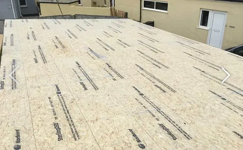 Wooden roof decking with OSB panels installed on a residential property.
