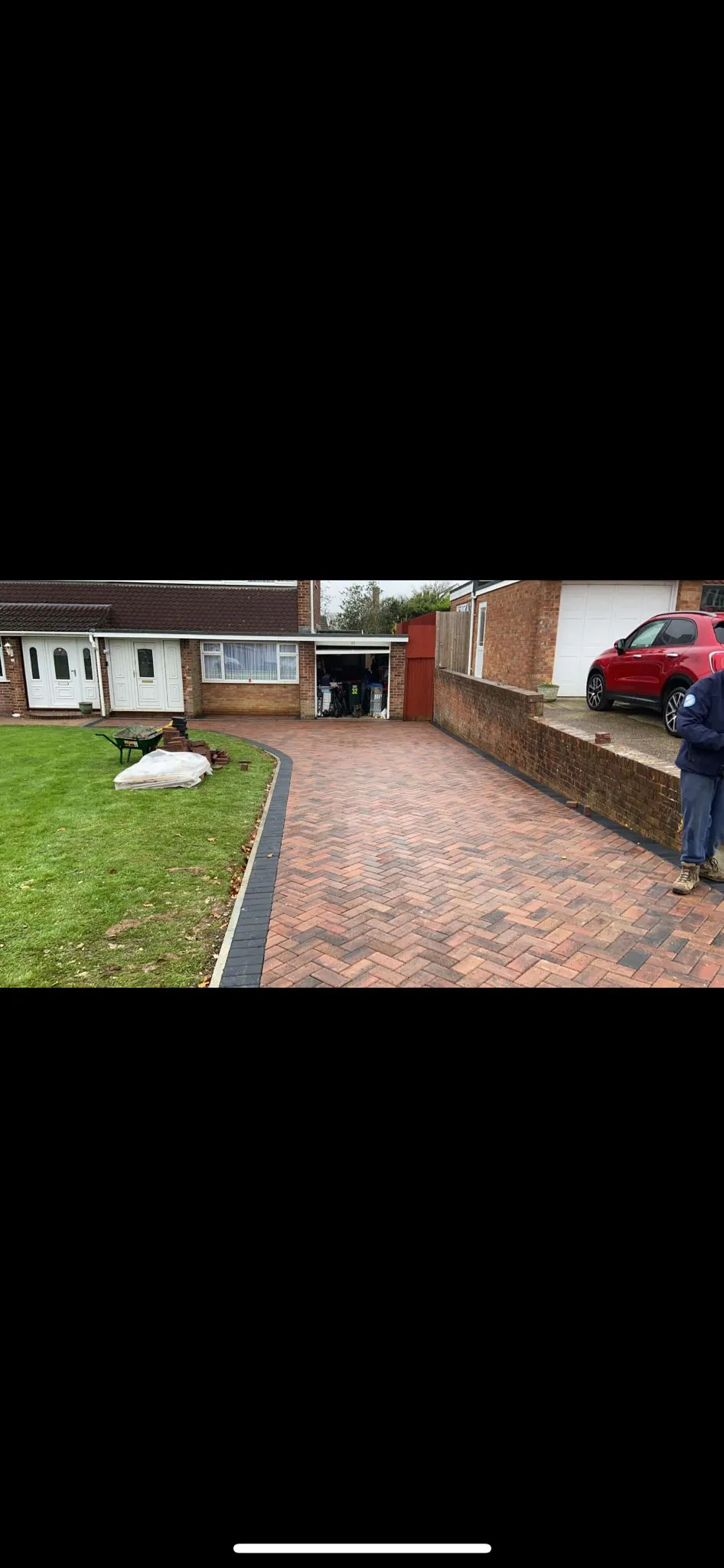 Expertly laid block paving driveway with herringbone pattern and charcoal border in Canterbury, Kent, completed by Kent Paving & Resin LTD.