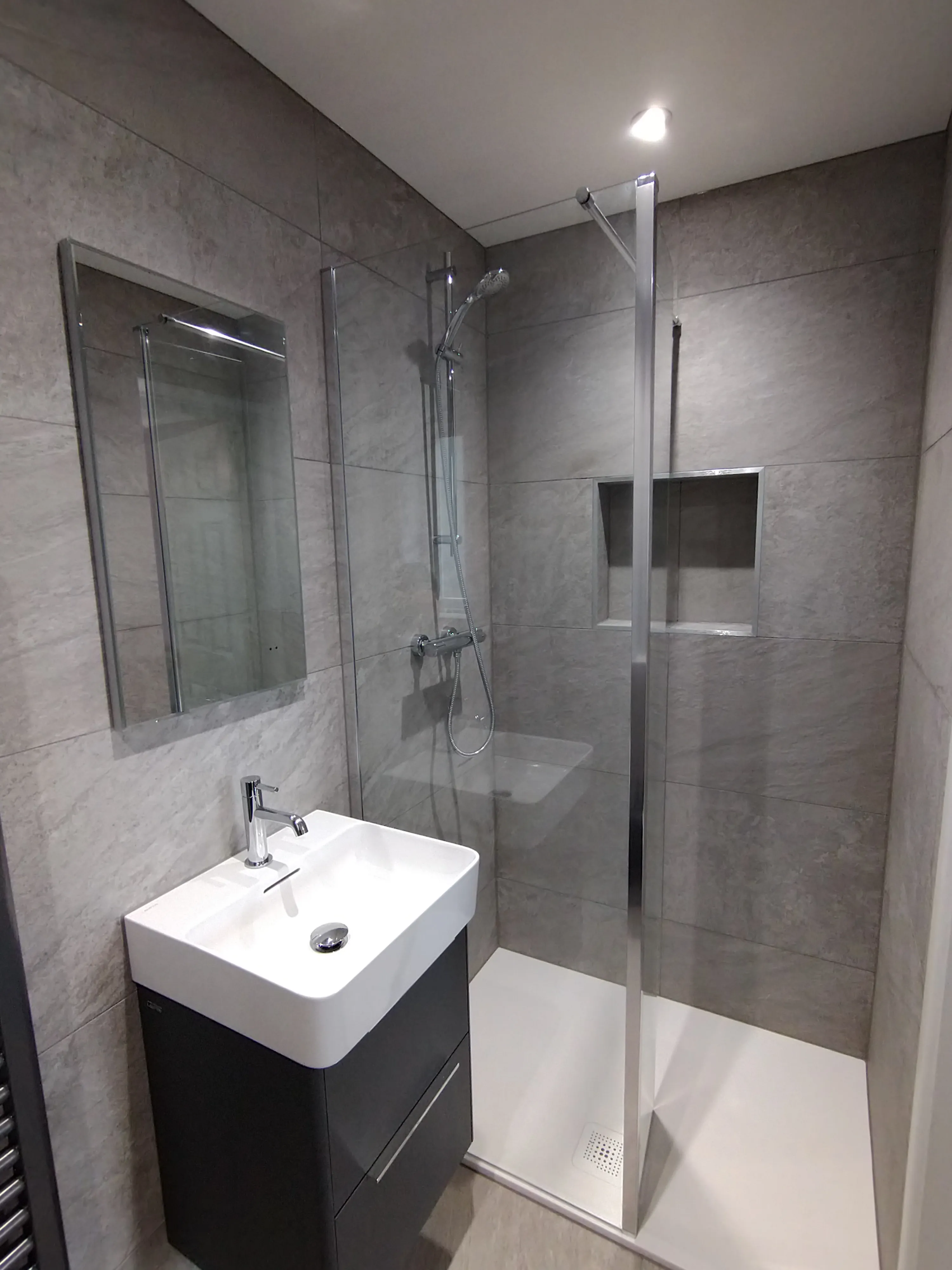 Modern luxury walk-in shower and vanity unit installation by Sands & Vossen in Plymouth.