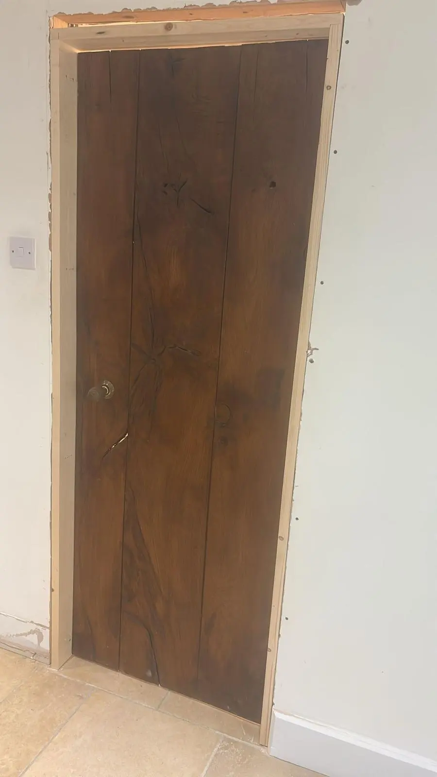 Bespoke solid wood heritage door installed during a luxury Cotswolds renovation by Fortura Construction LTD