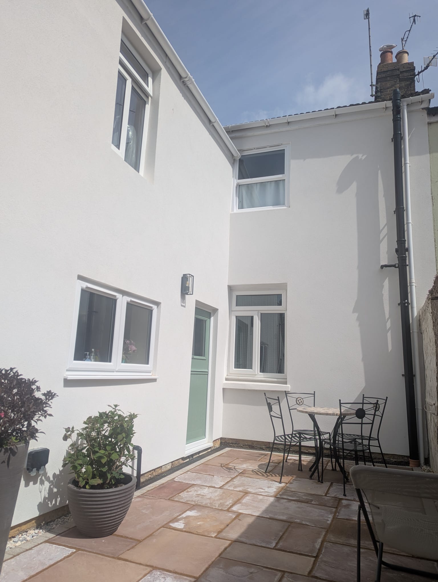 High-quality white external rendering on a residential property in Portslade