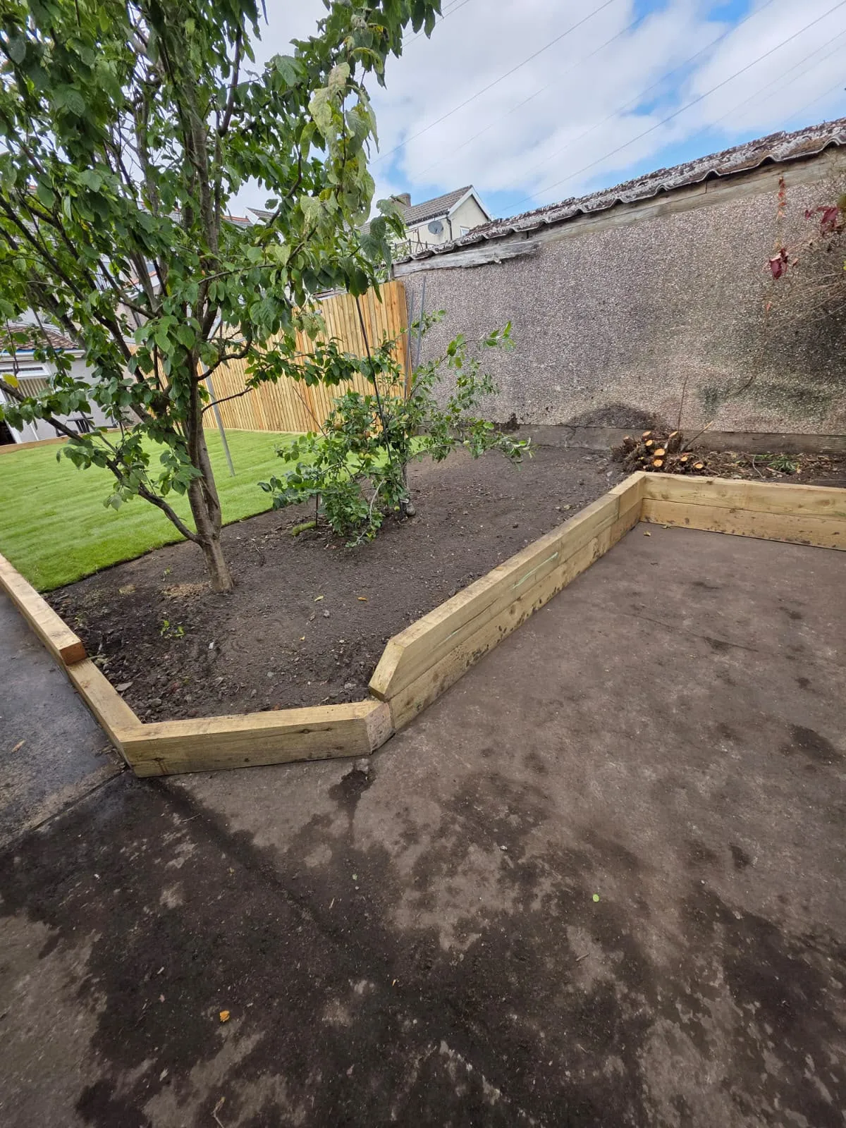 Garden clearance and timber raised bed edging installed in a Pontypool garden