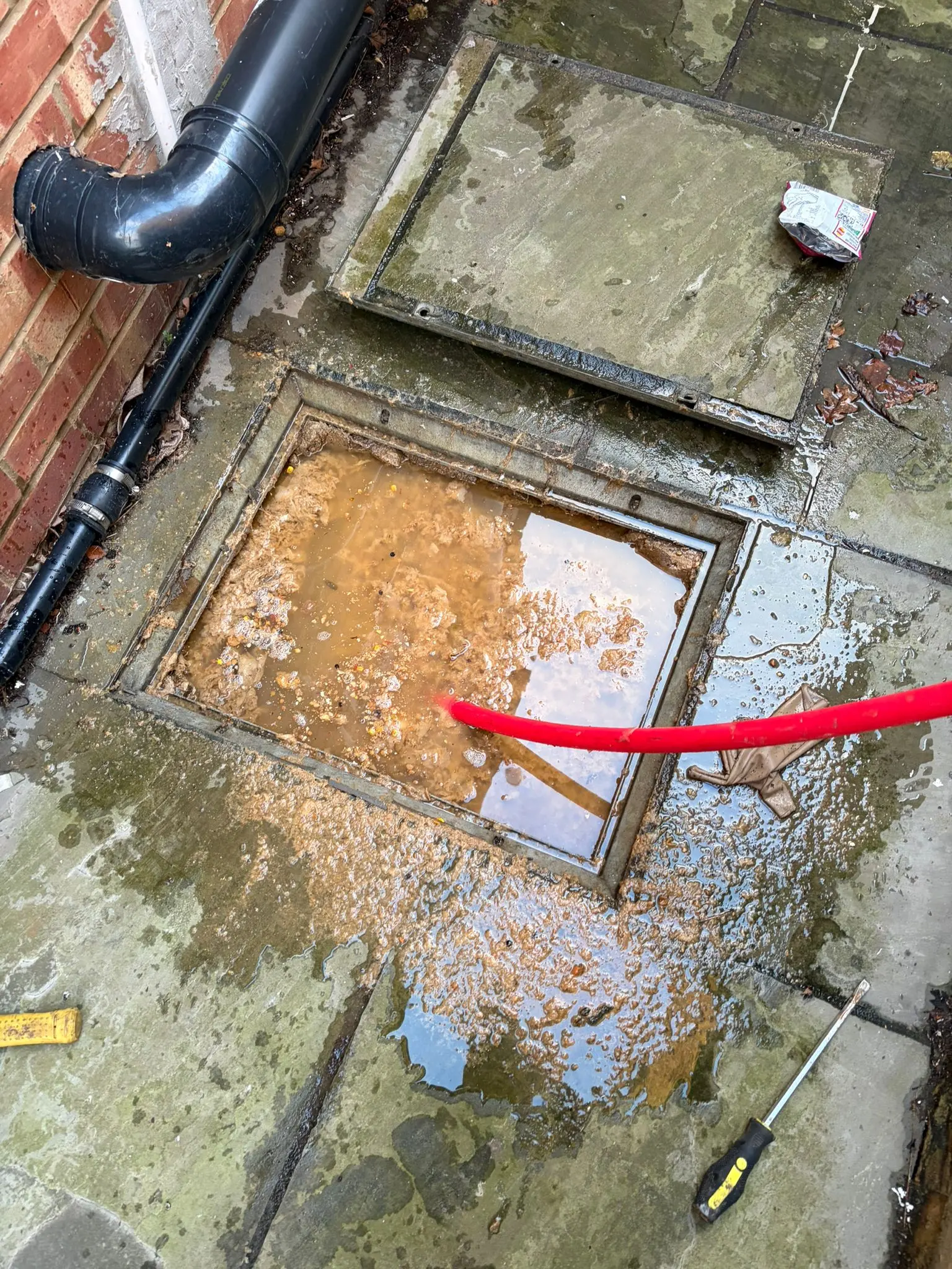 Emergency high-pressure drain jetting to clear a blocked outside drain in Slough.