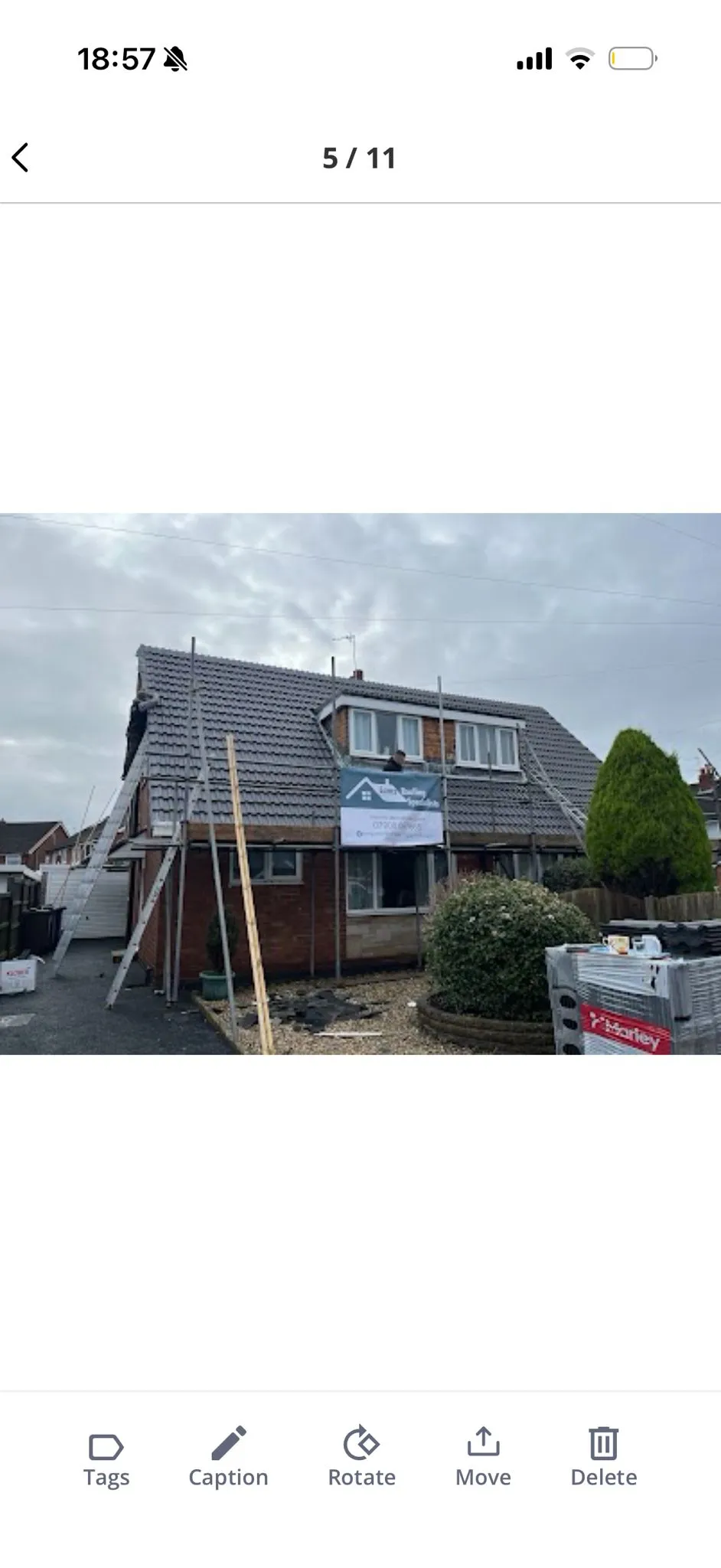 New roof installation in progress on a Lancashire home with scaffolding and company branding
