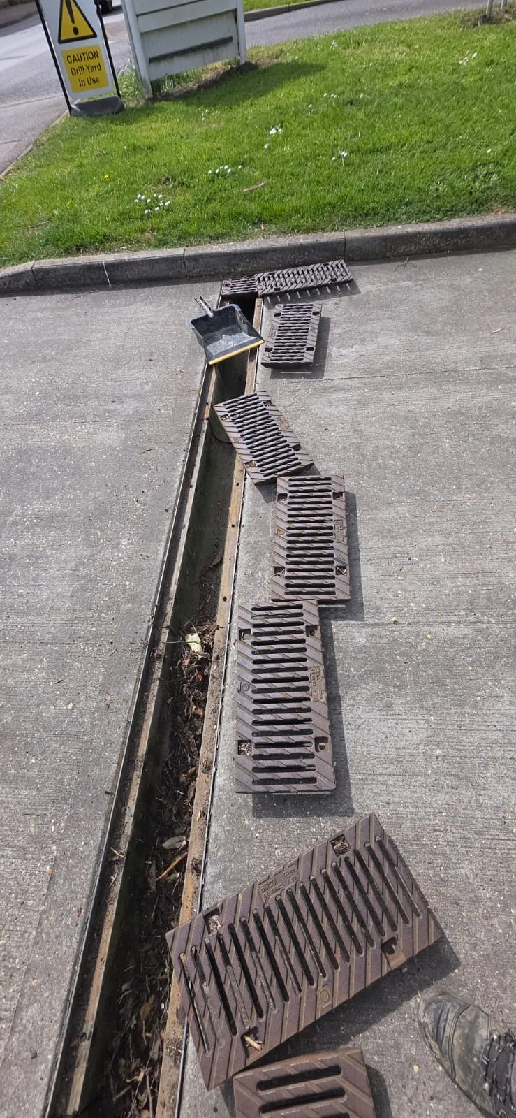 Professional drain unblocking and cleaning of a channel drain in Suffolk by FLEX PROPERTY SERVICES.