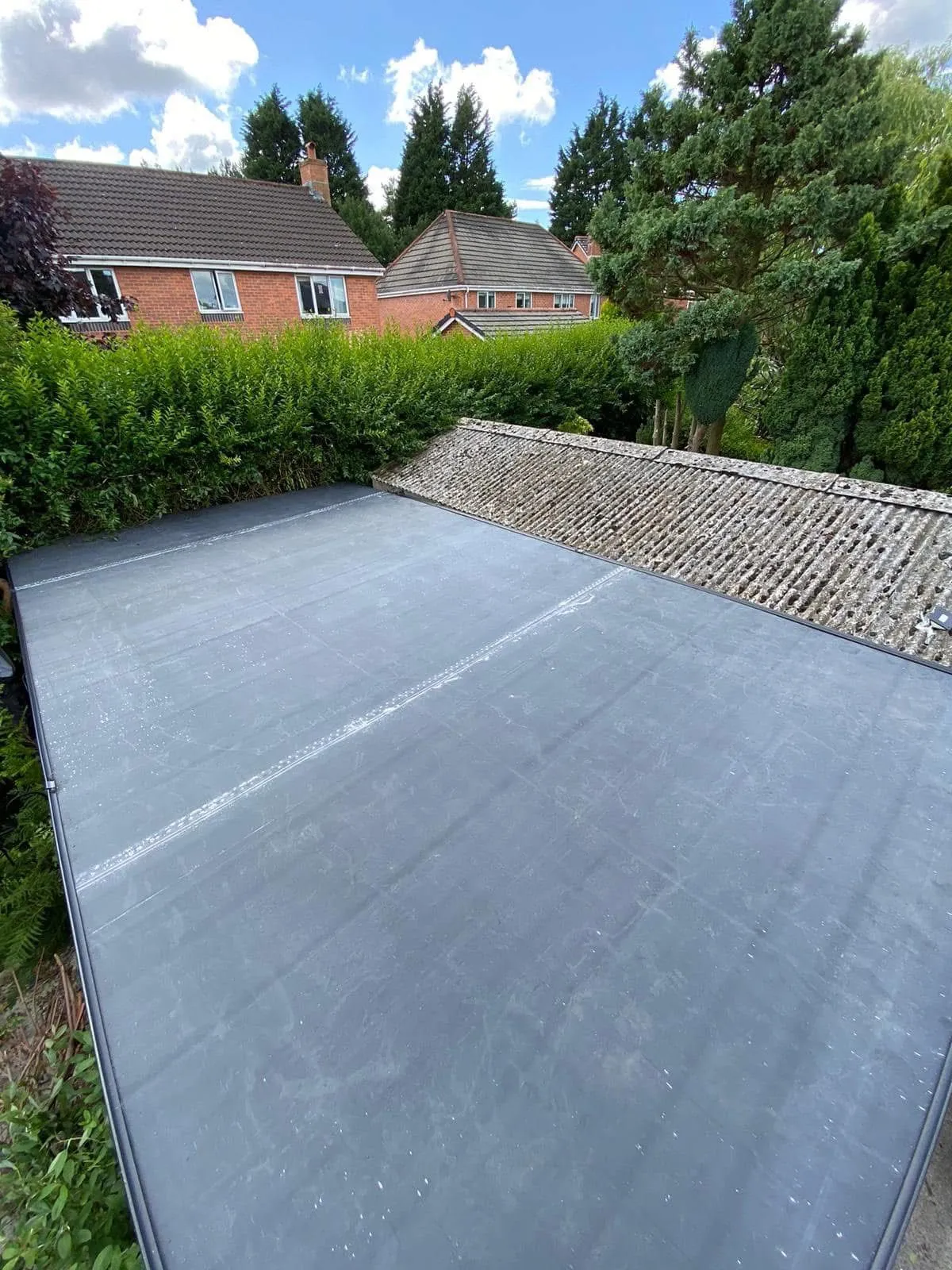 New EPDM rubber flat roof installation in a residential garden in Lancashire.