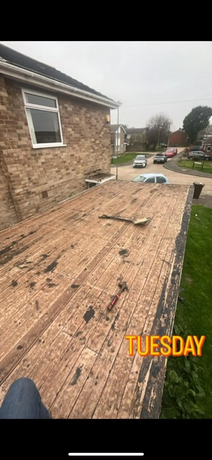 Flat roof deck exposed during a professional roof replacement in Plymouth