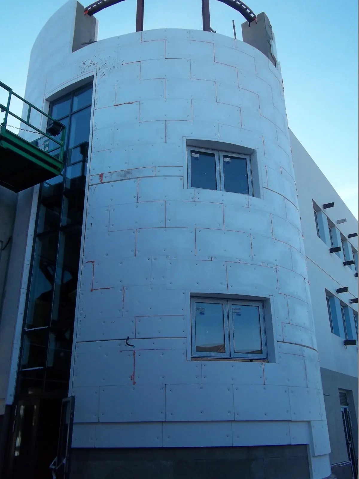 External wall insulation boards being applied to a commercial building in South Wales