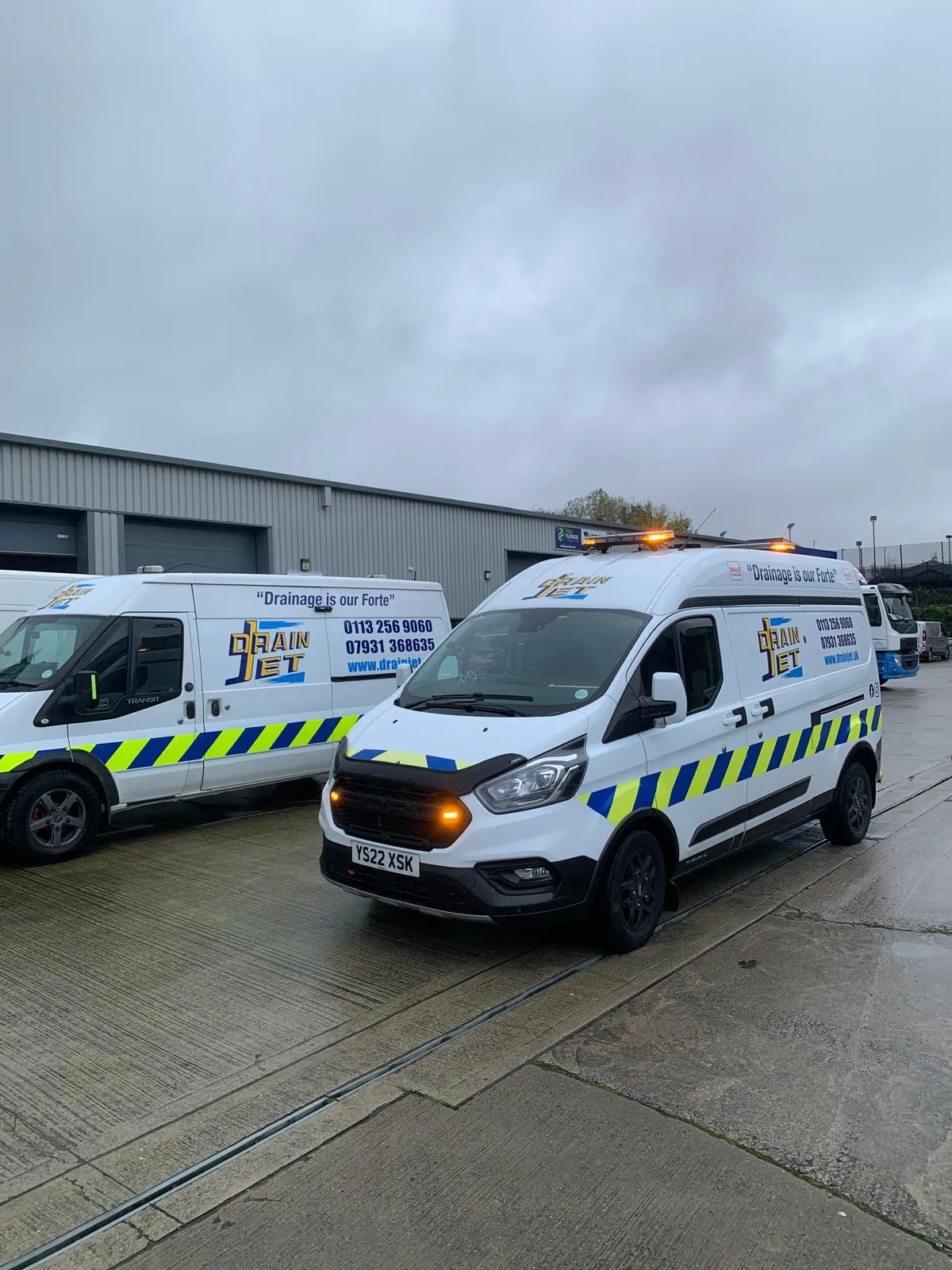 A fleet of Drain Jet service vans parked in Leeds, ready for emergency drainage and drain unblocking services.