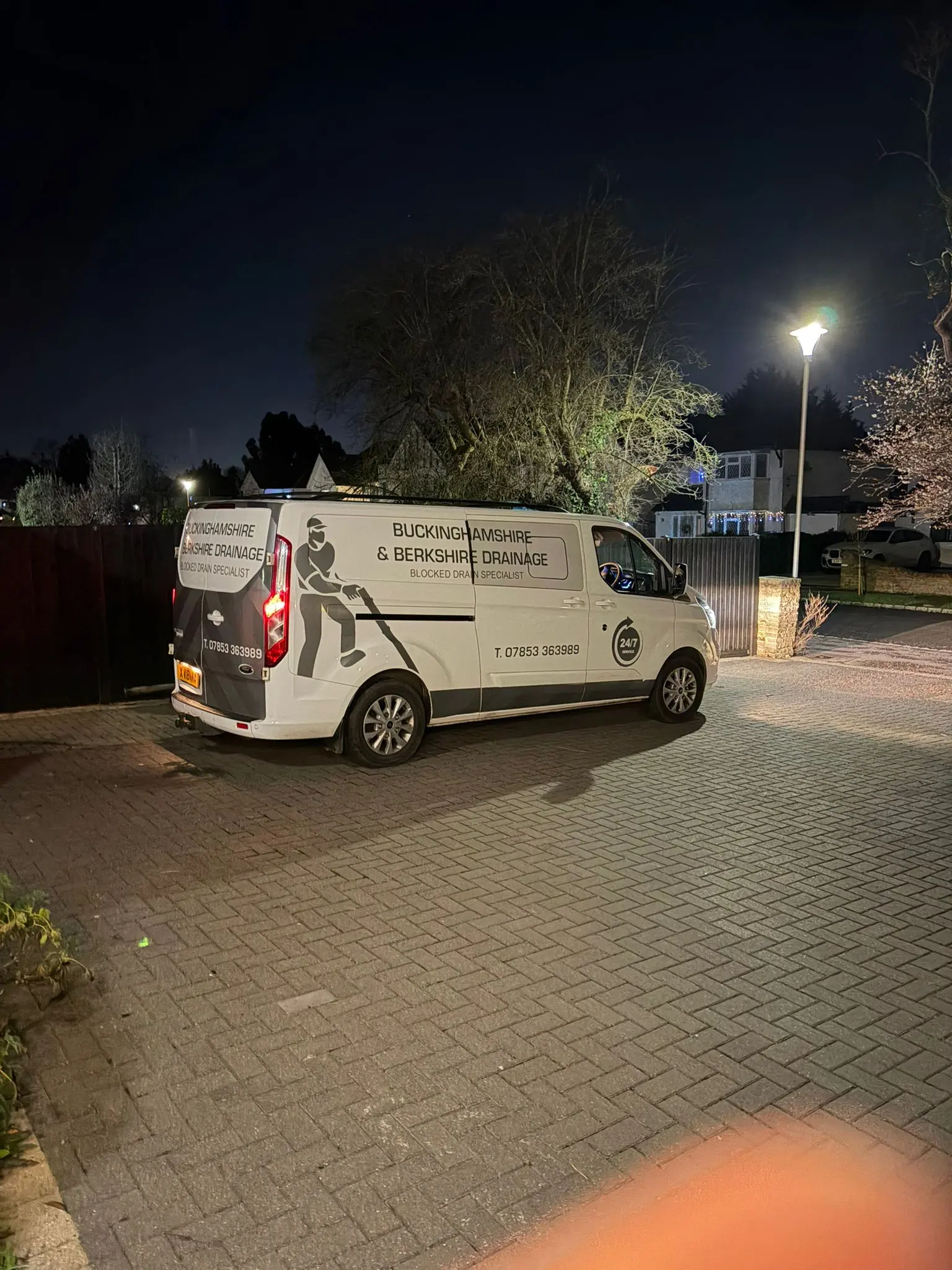 Buckinghamshire & Berkshire Drainage service van on a driveway at night