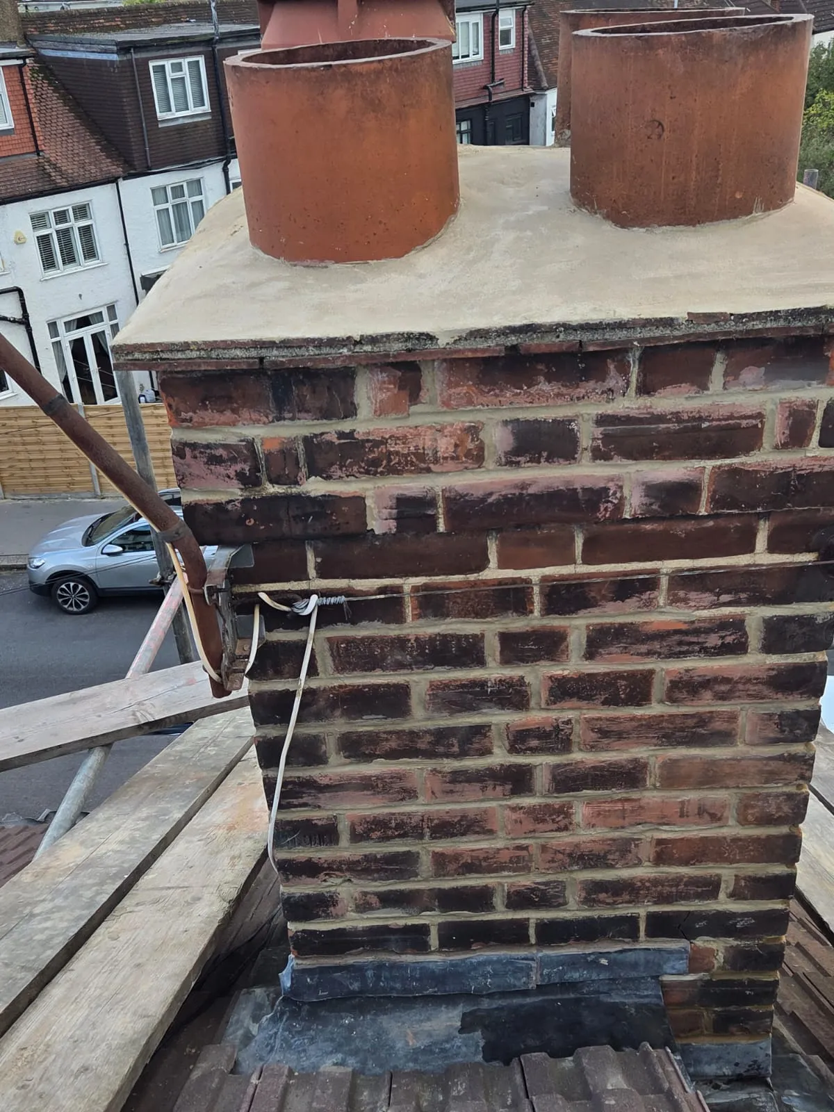 Professional chimney repairs and leadwork on a domestic roof in Cornwall