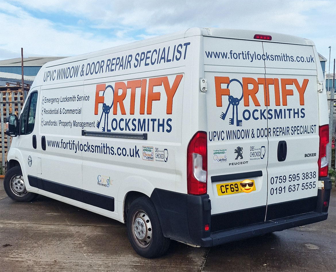 A white Fortify Locksmiths service van with company logos and contact information for locksmith services in Newcastle and Gateshead.