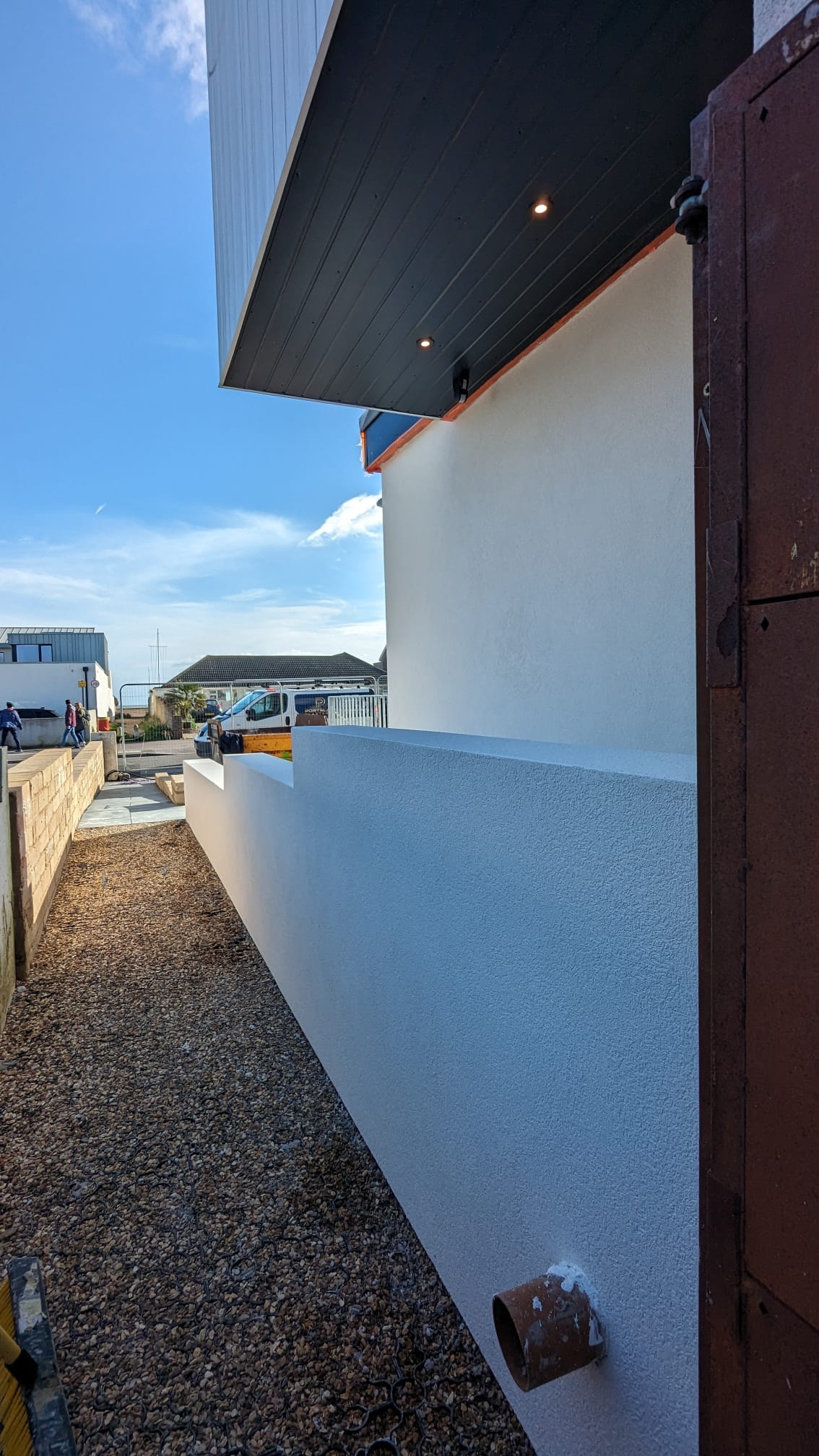 Expert external rendering on a residential property wall by Portslade Plastering.