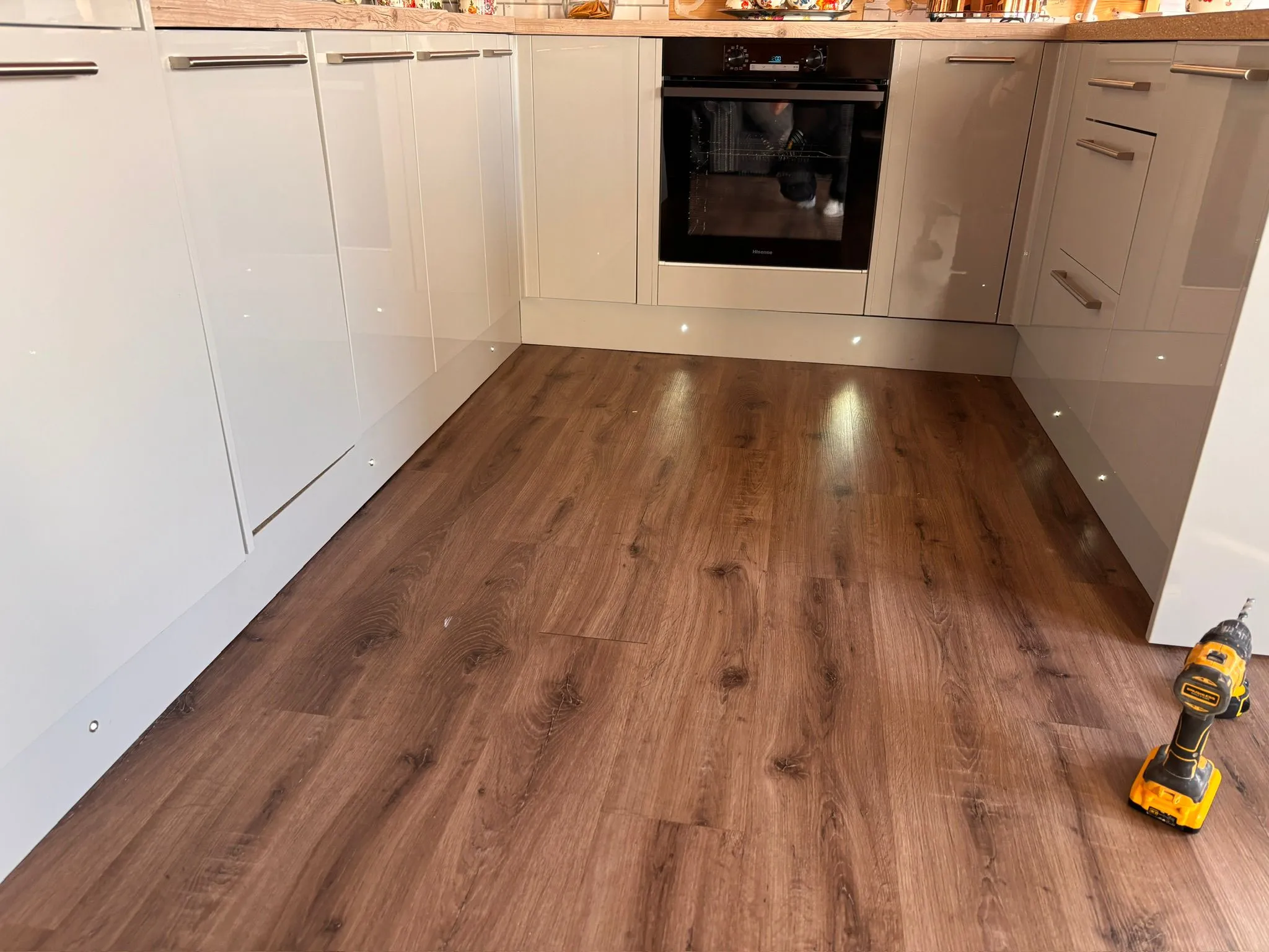 LED plinth feature lighting installation along kitchen cabinet kickboards