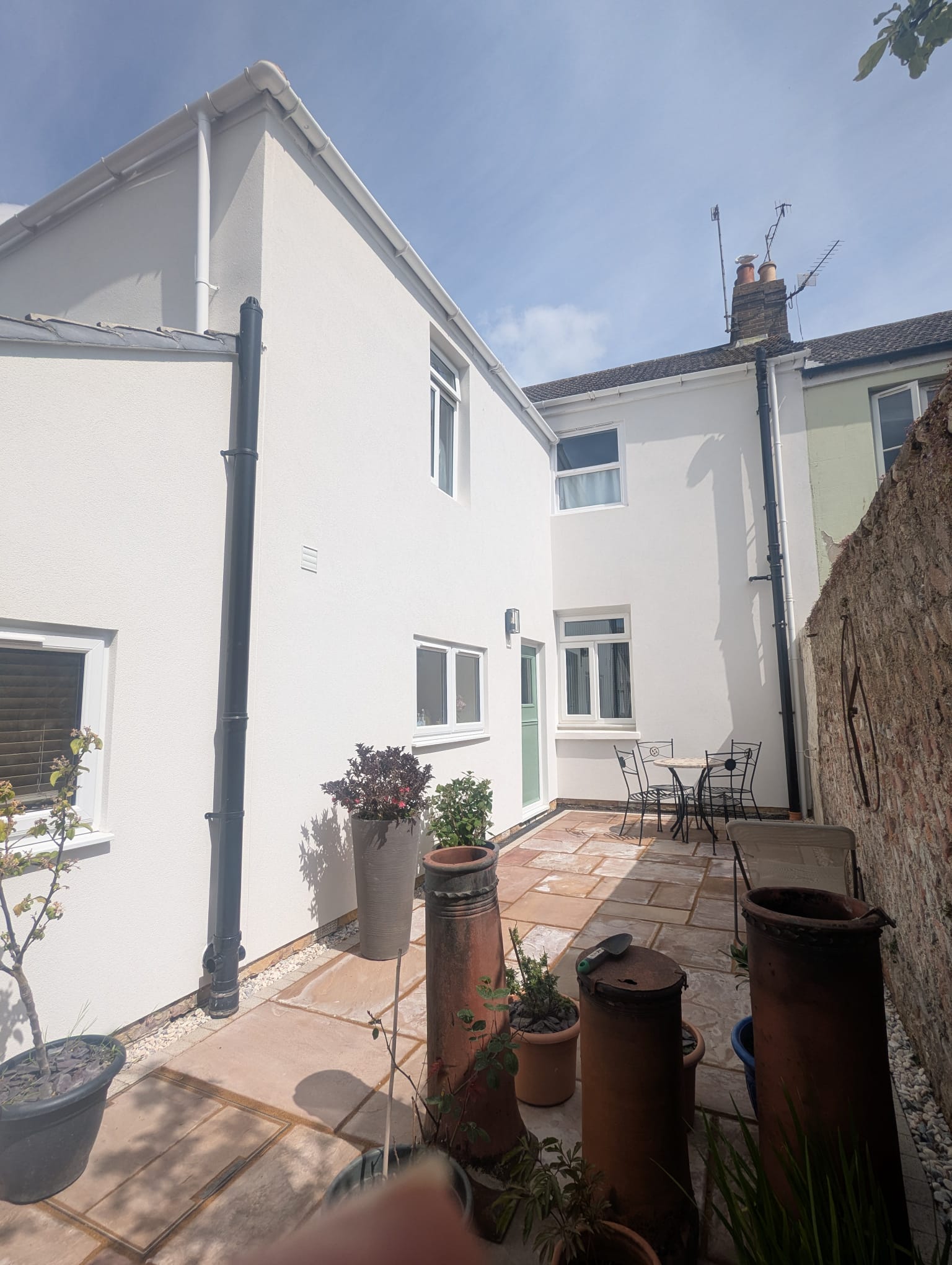 Modern white external rendering on a house, completed by professional renderers in the Sussex area.