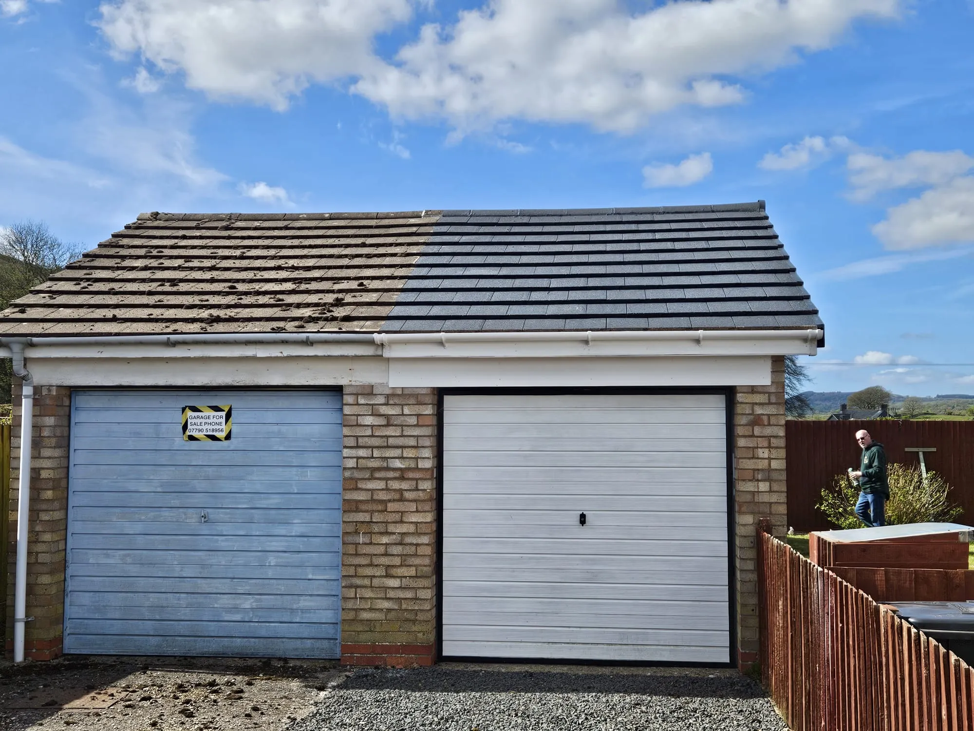 A garage roof with one half covered in moss and dirt and the other half spotlessly clean, showcasing roof cleaning and moss removal services.