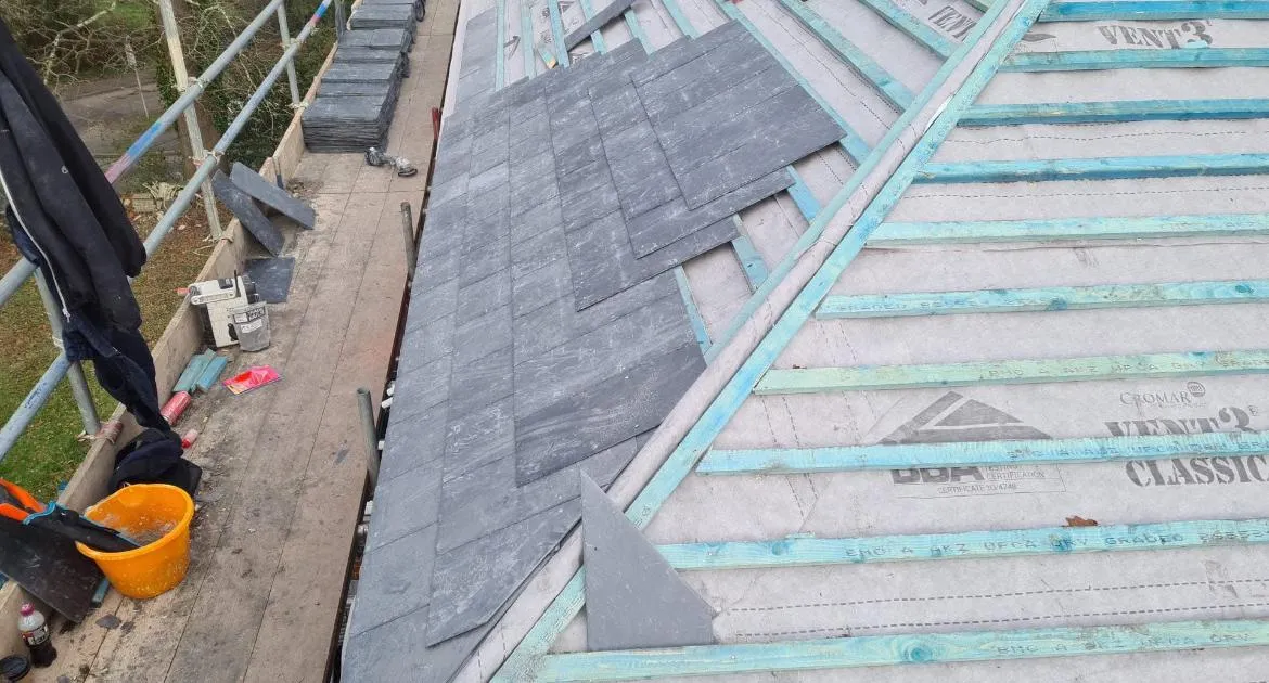 Expert slate roof installation on a pitched roof by Sky Top Roofing LTD